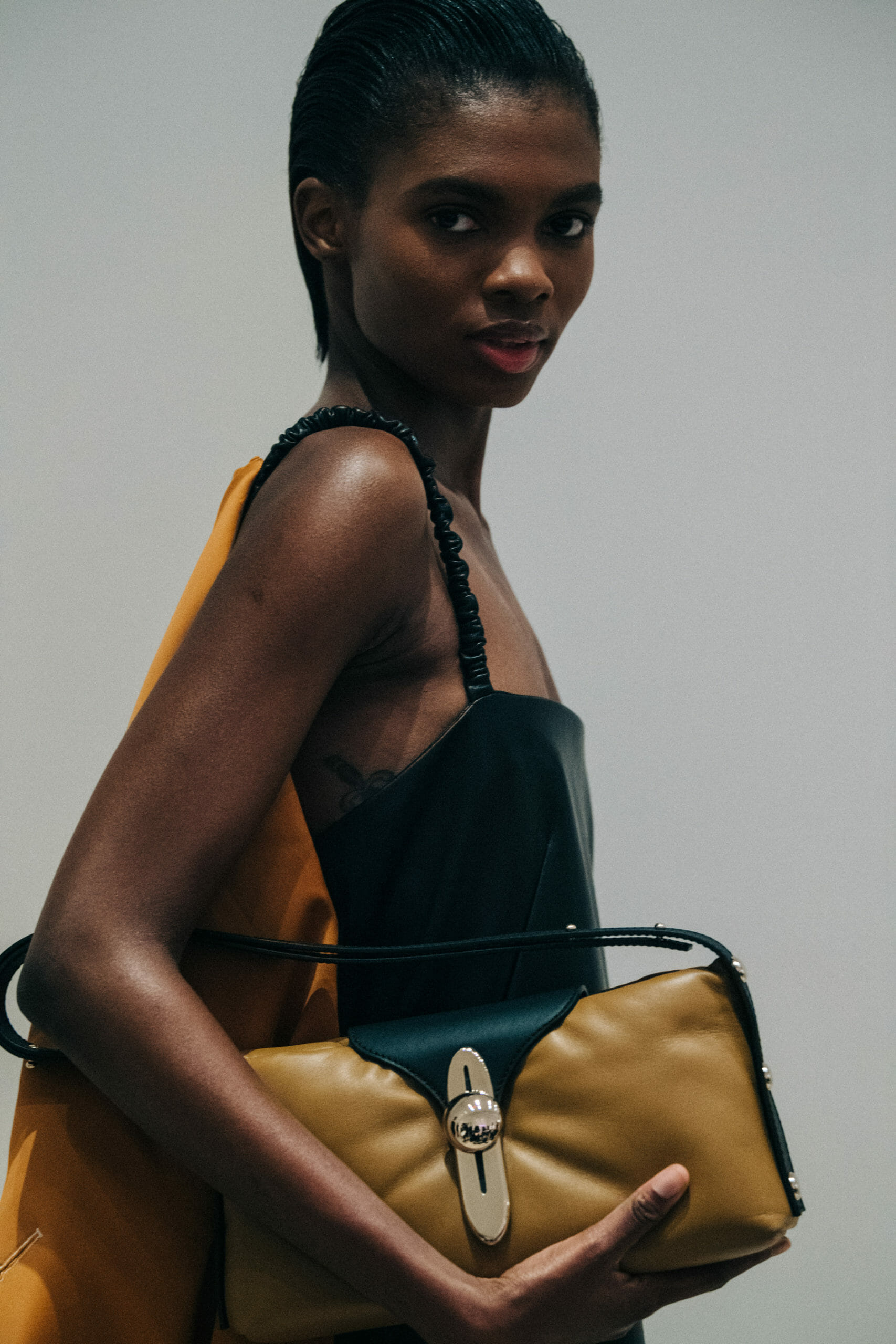Model wearing black Proenza Schouler dress