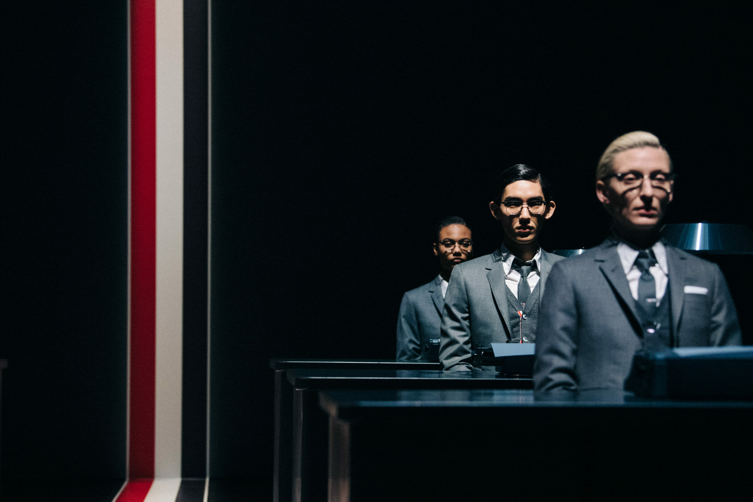 Models wearing Thom Browne suit