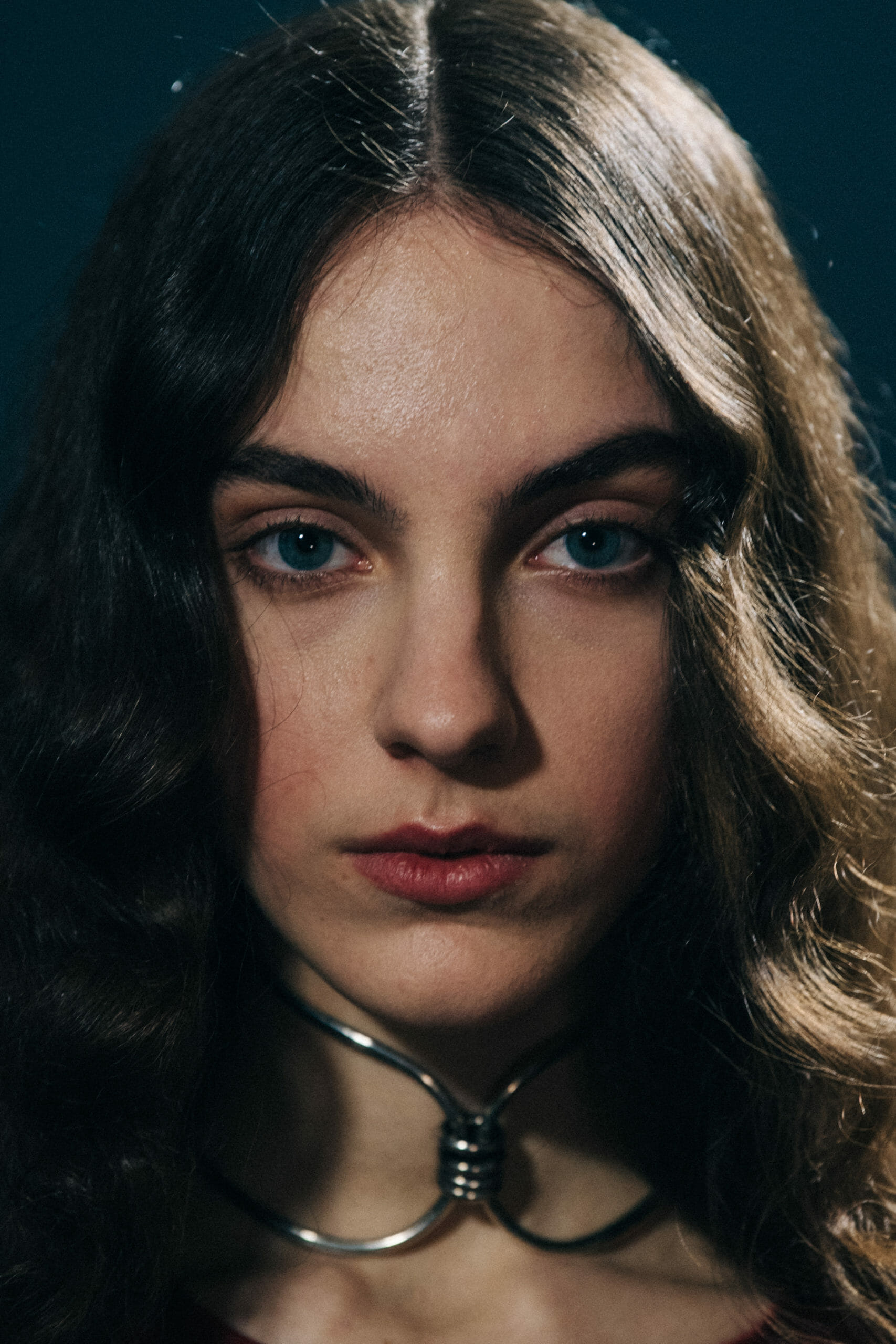 Model wearing metal neckpiece