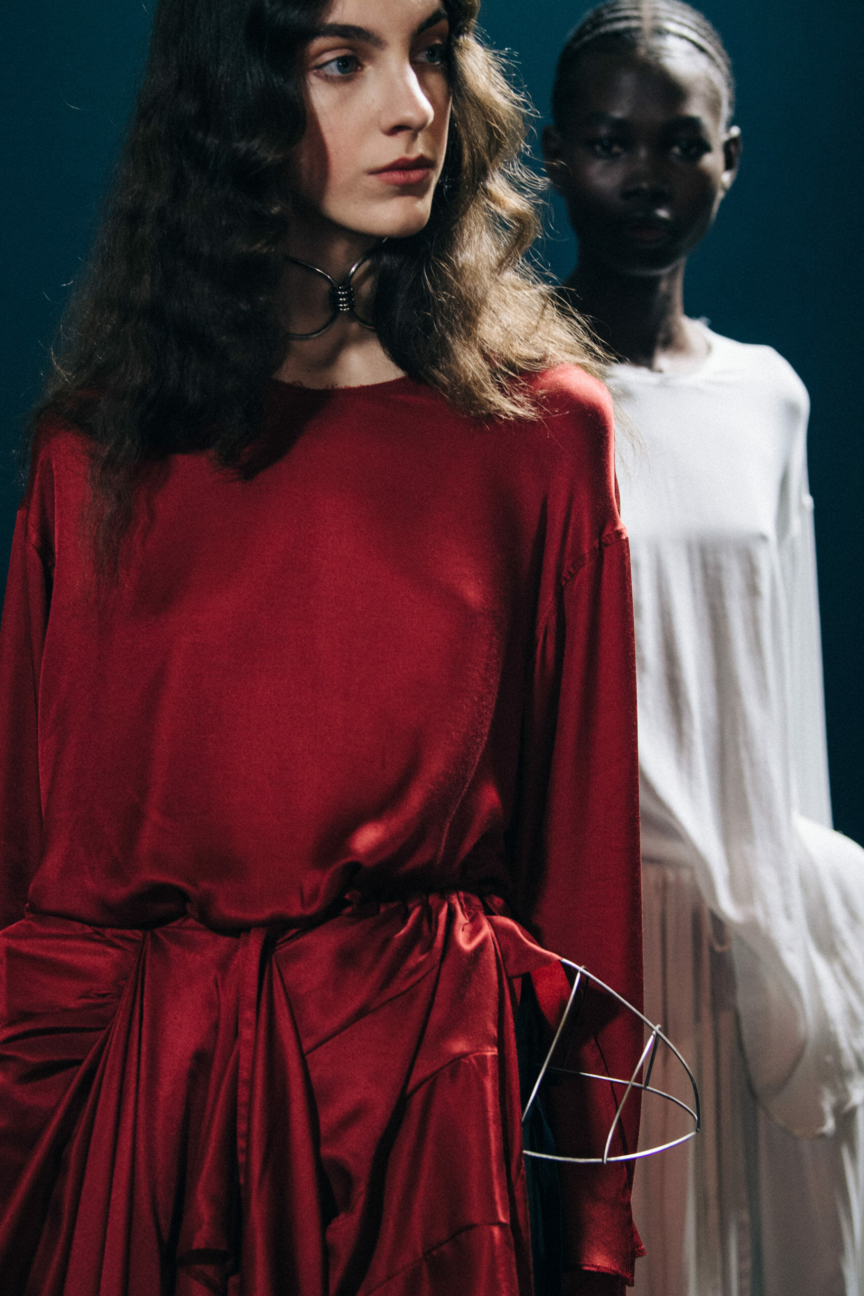 Model wearing red Ann Demeulemeester dress