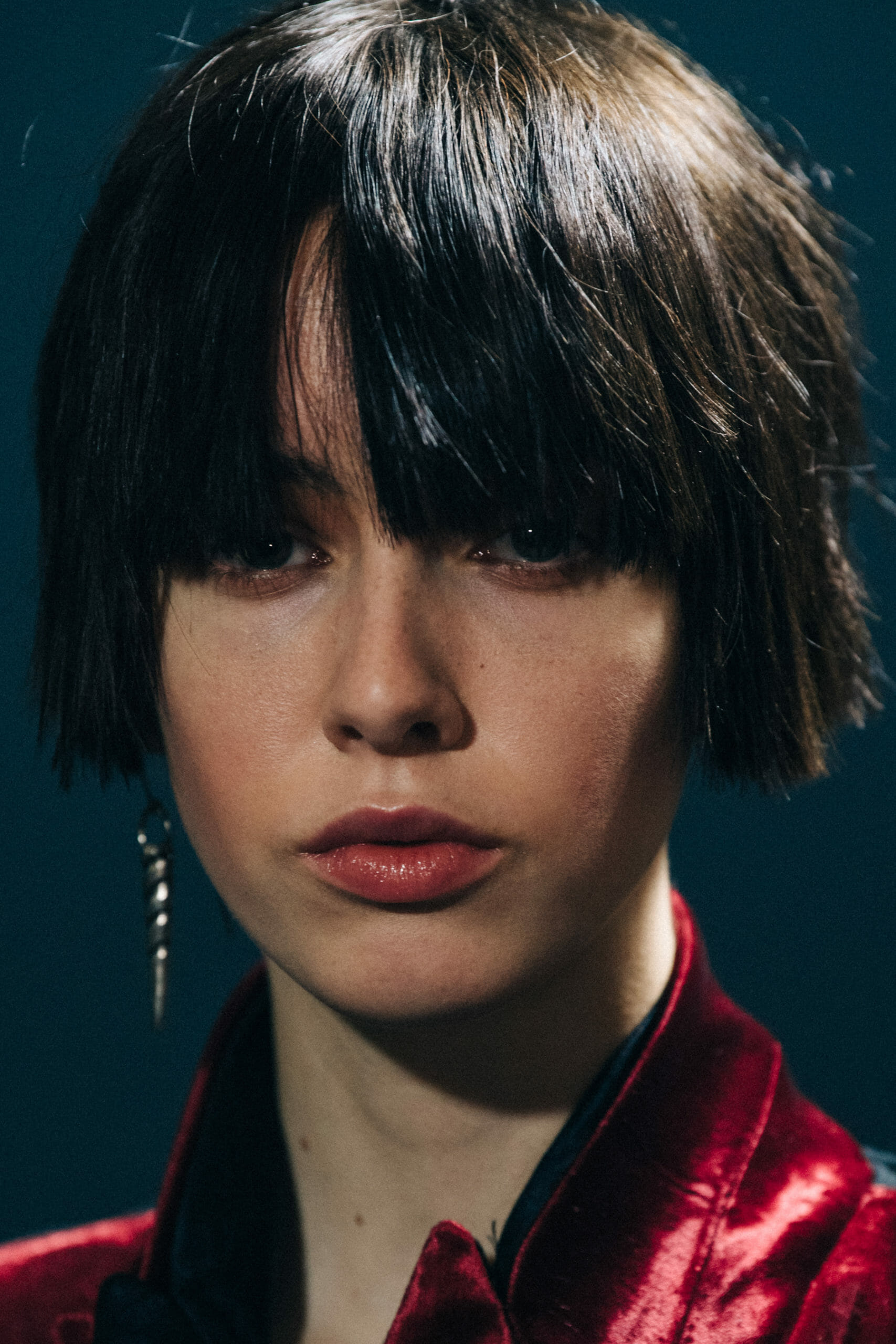 Model wearing red Ann Demeulemeester dress