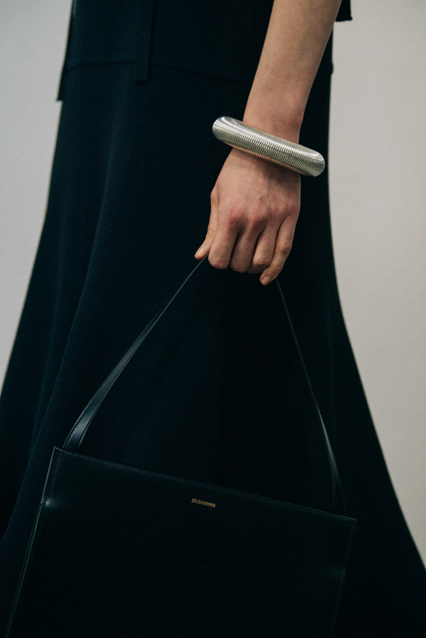Model wearing black Jil Sander outfit