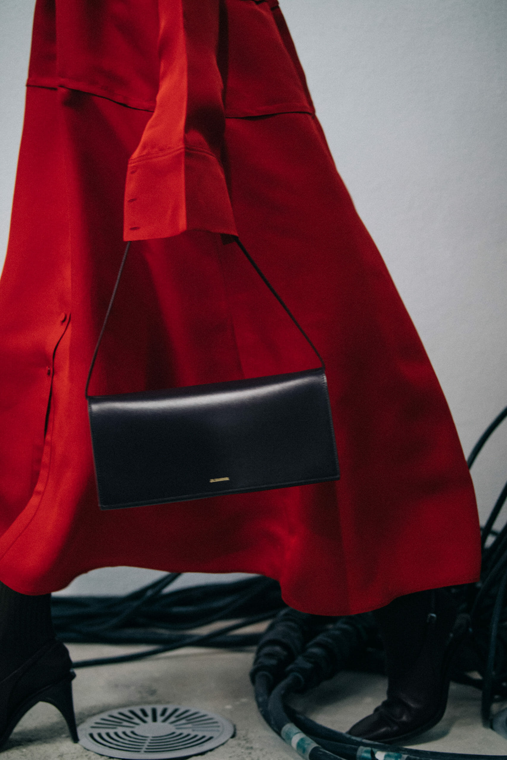 Model wearing red Jil Sander outfit