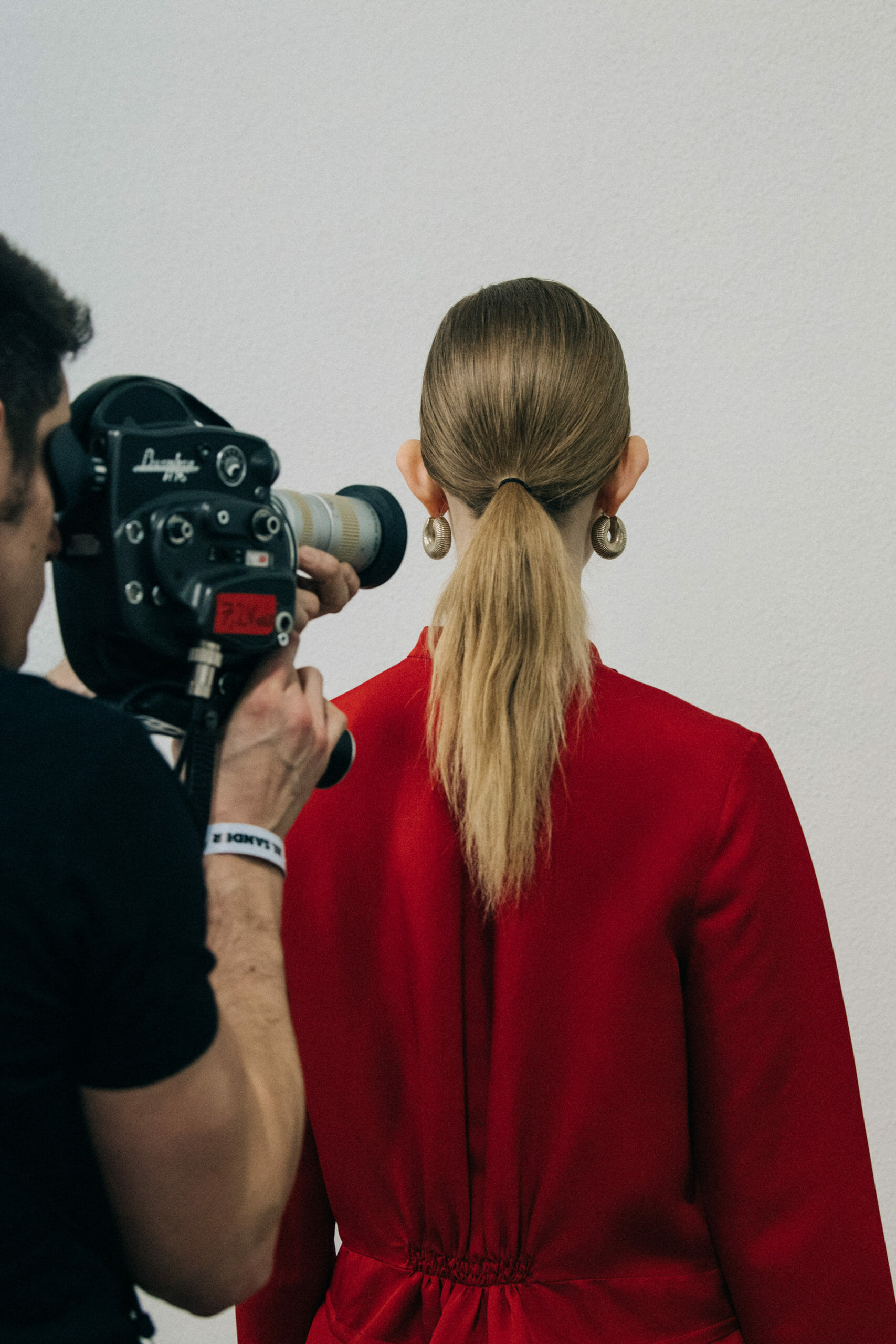 Model wearing red Jil Sander outfit