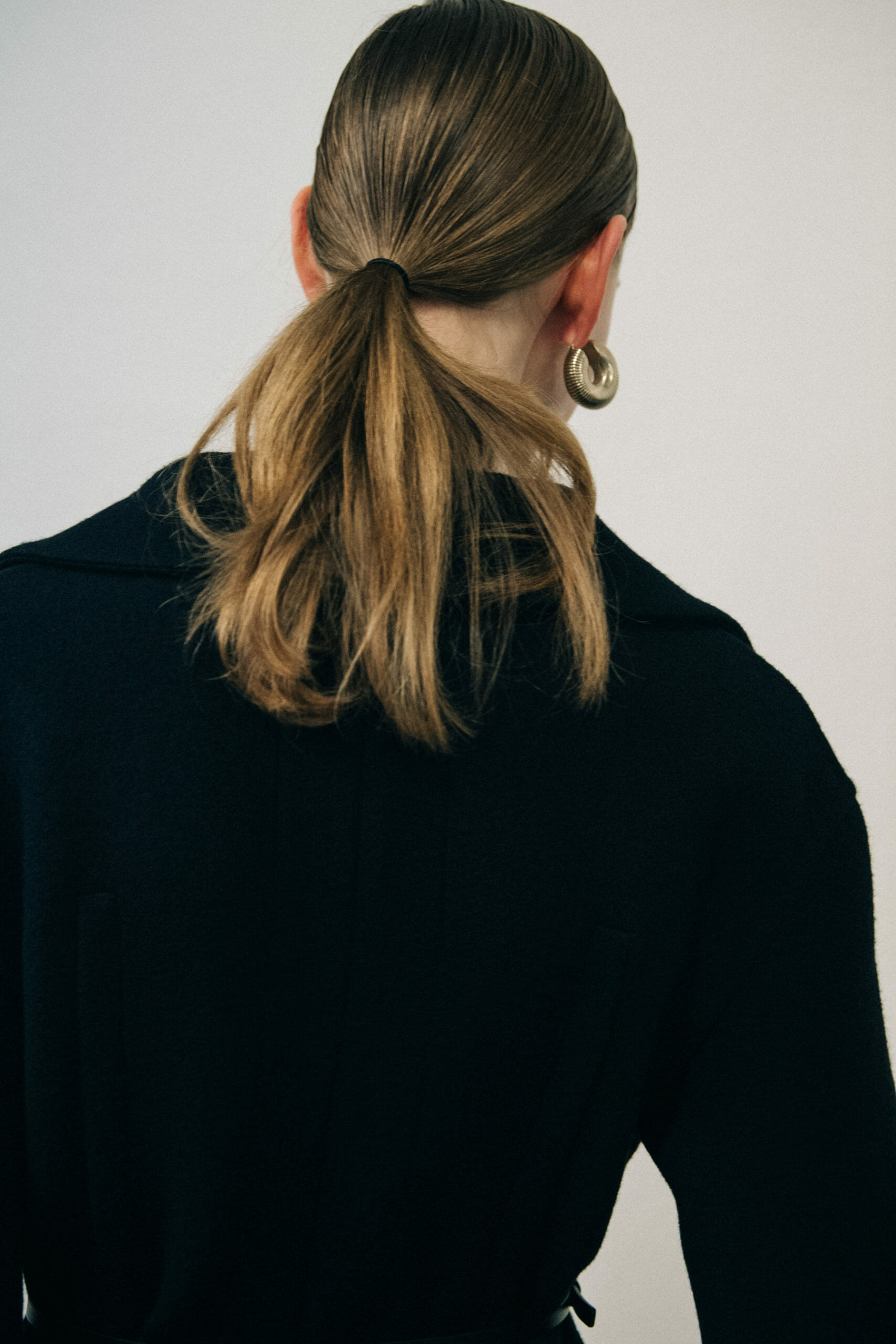 Model wearing black Jil Sander outfit
