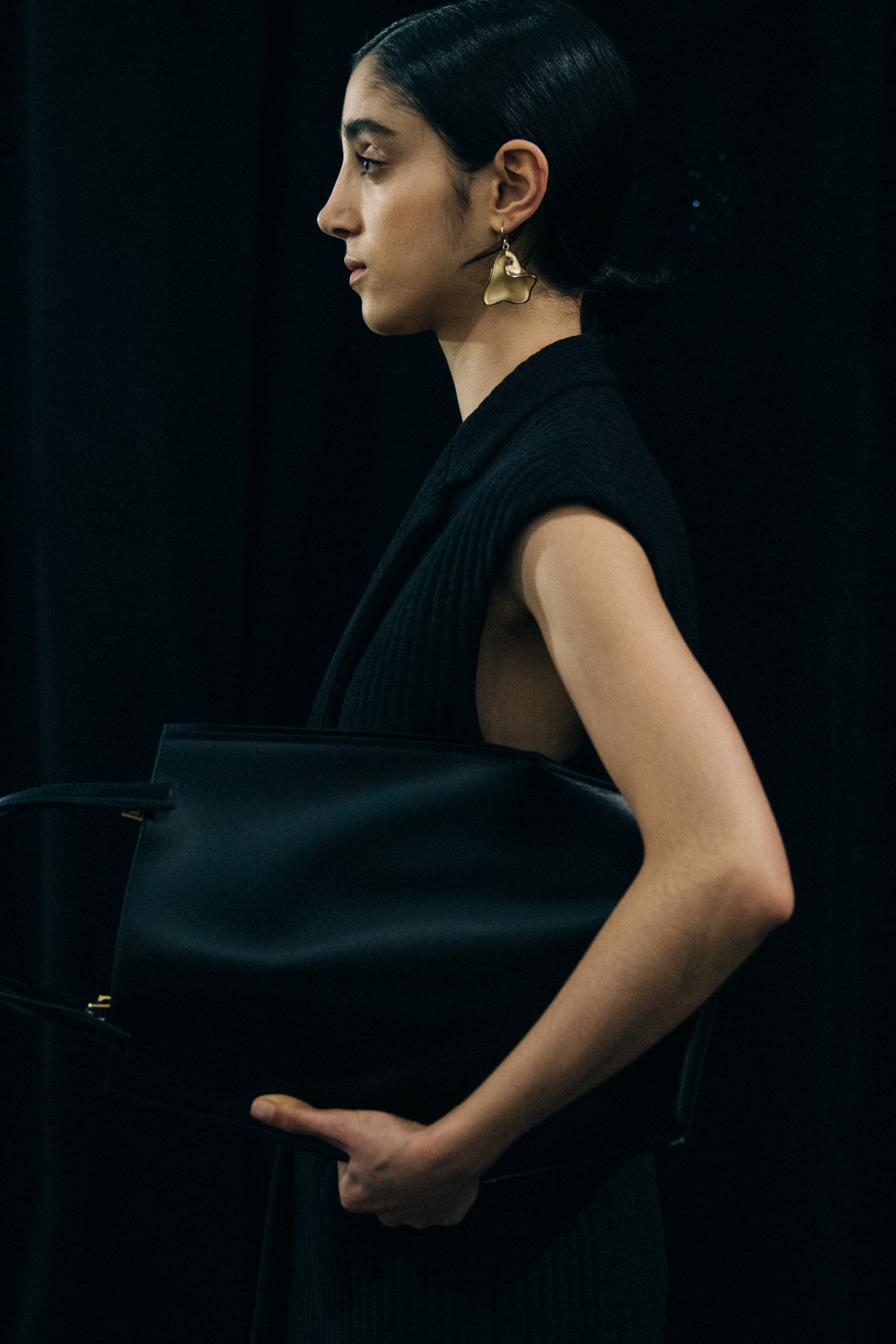 Model wearing black Jil Sander outfit