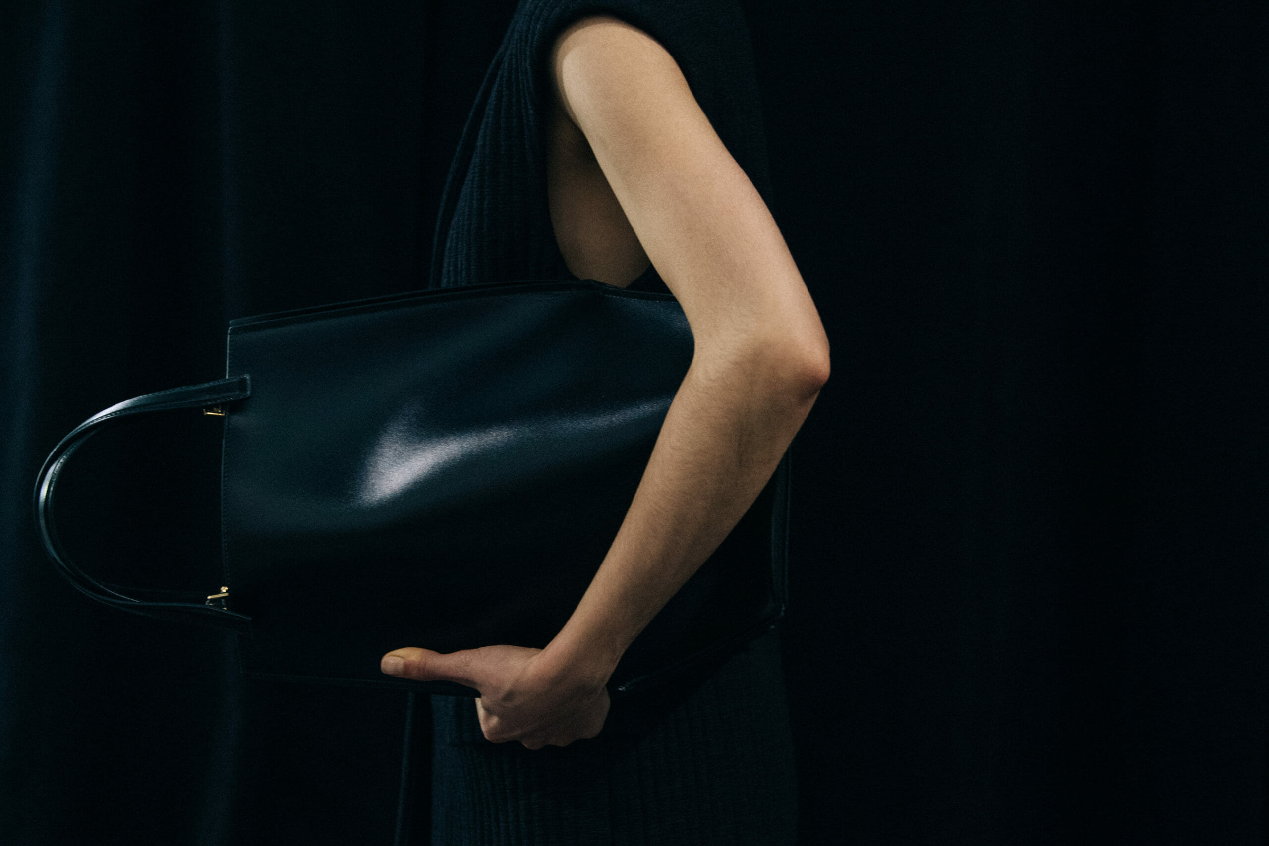 Model wearing black Jil Sander outfit