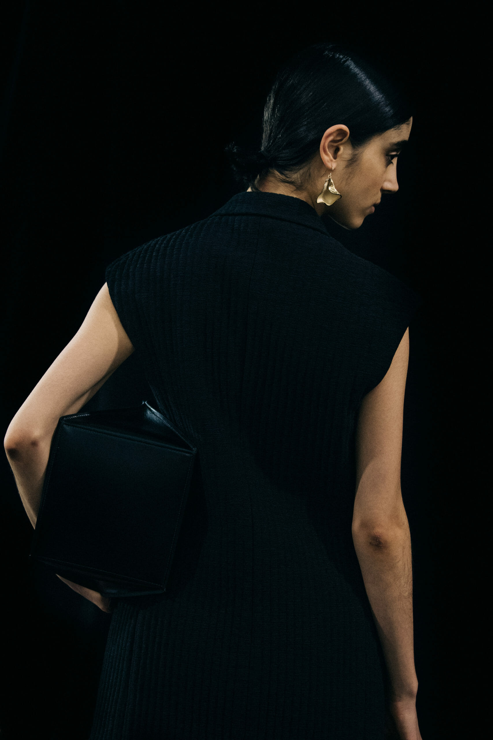 Model wearing black Jil Sander outfit
