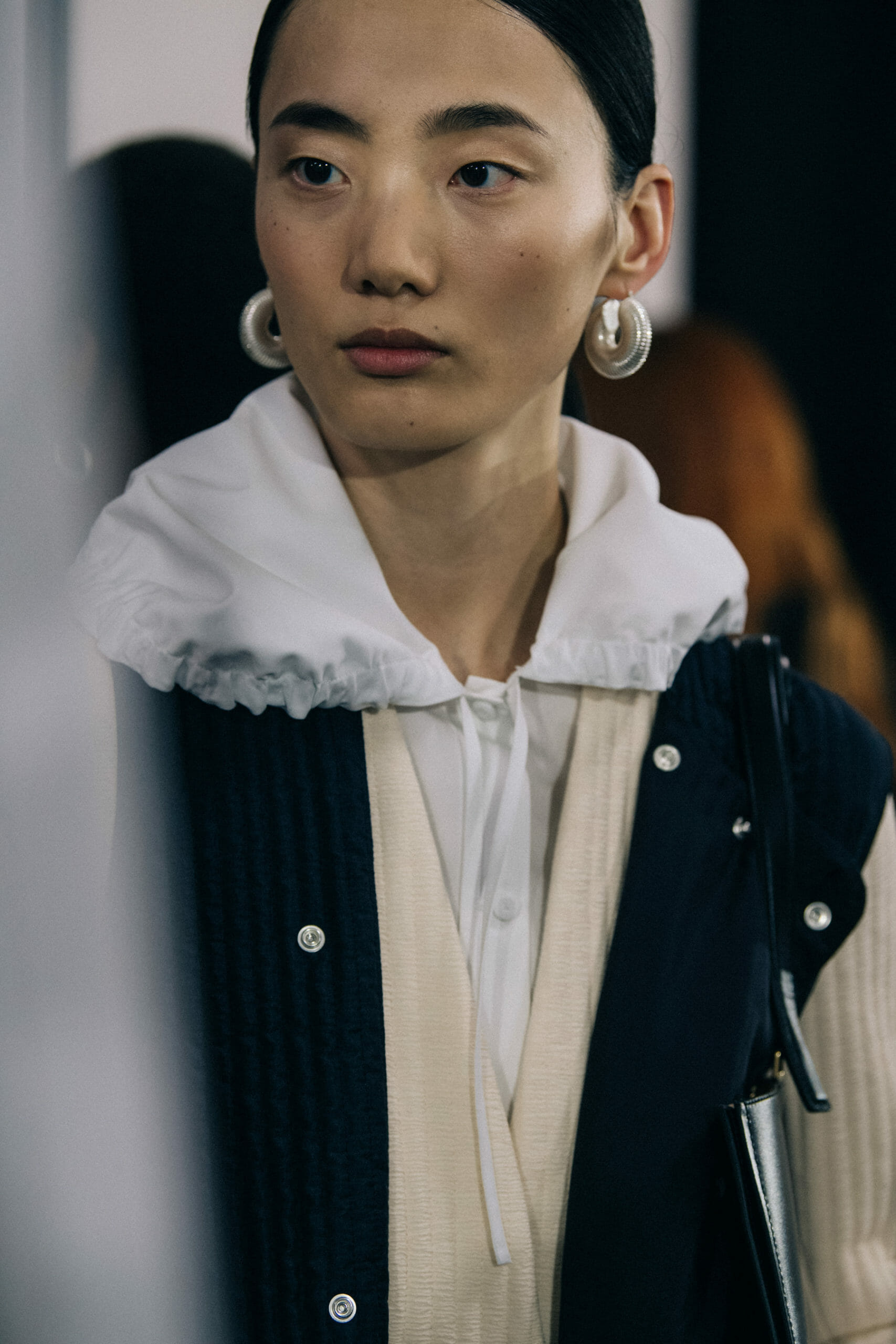 Model wearing light Jil Sander outfit
