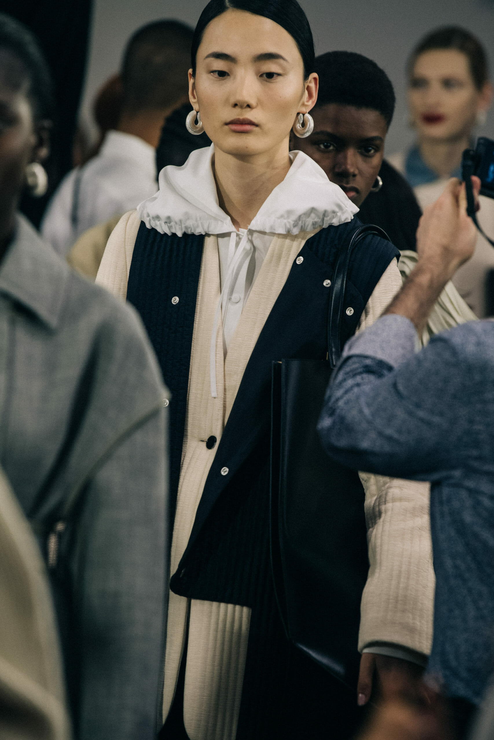 Model wearing Jil Sander earrings