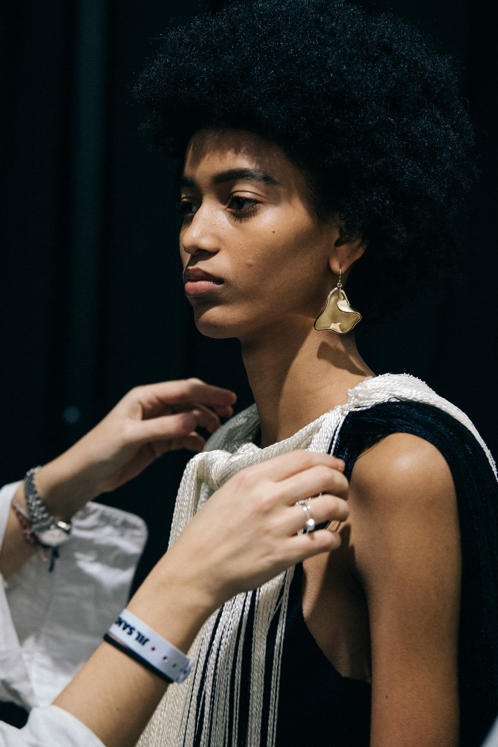 Model wearing light Jil Sander outfit