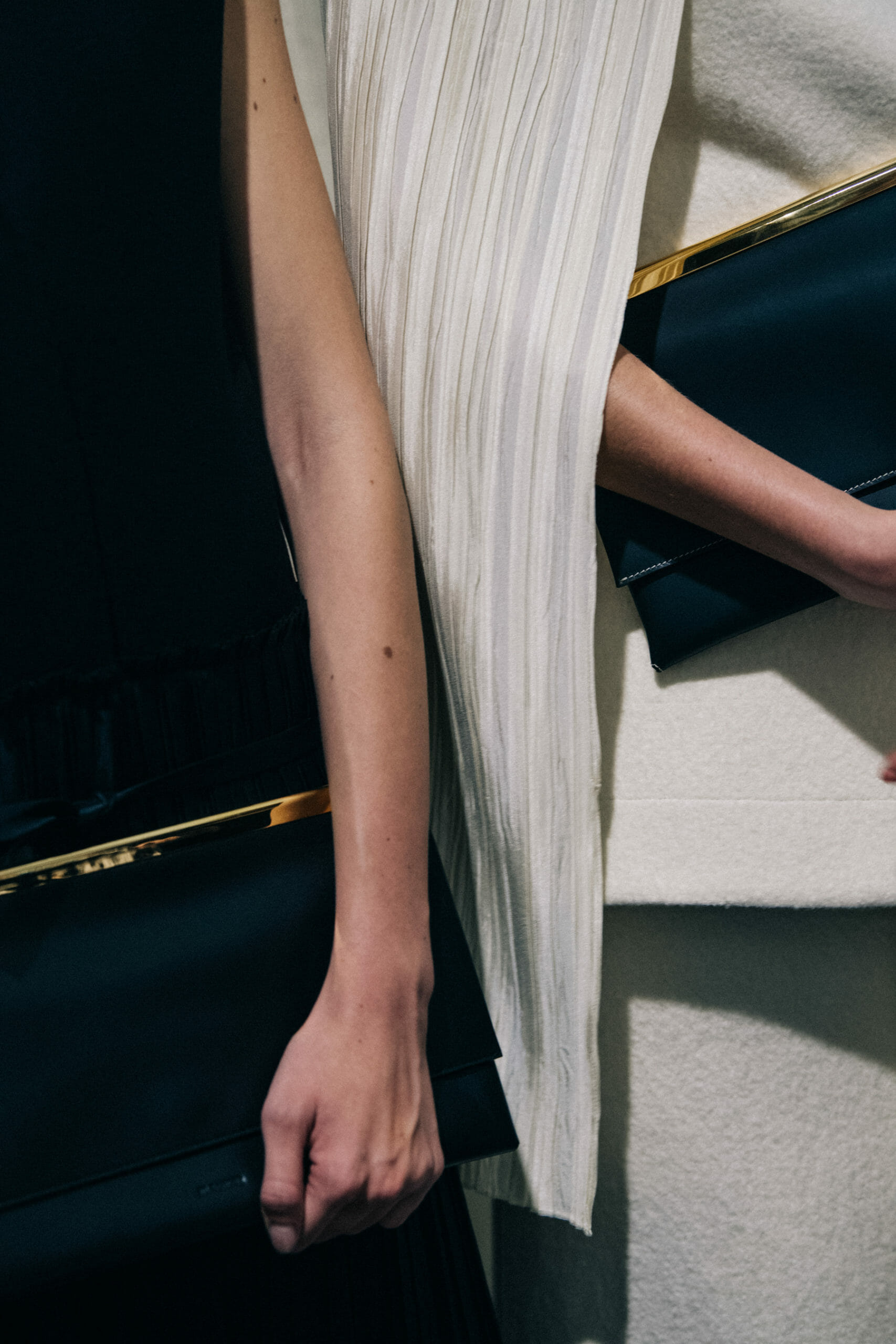 Model wearing light Jil Sander outfit