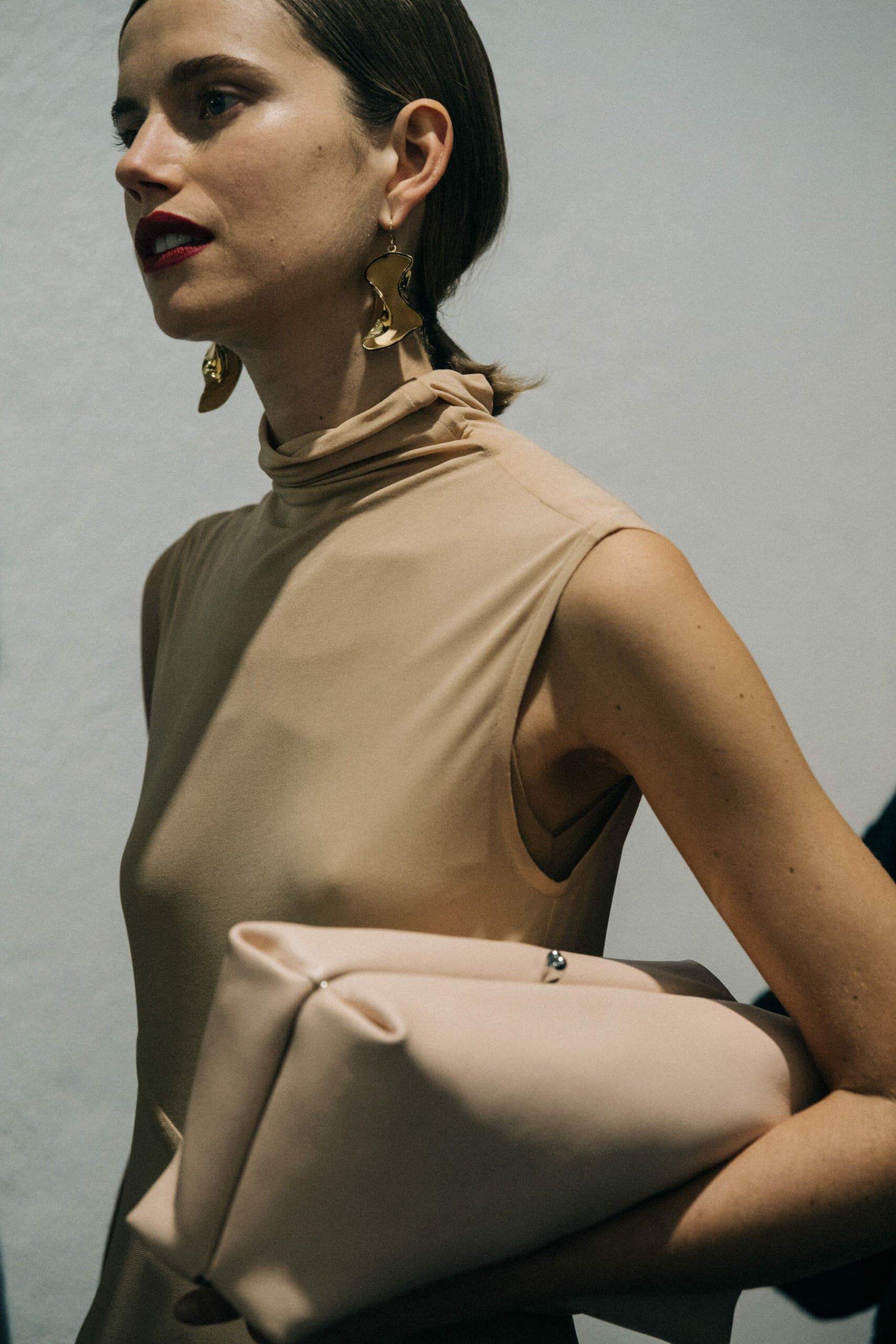 Model wearing light Jil Sander outfit