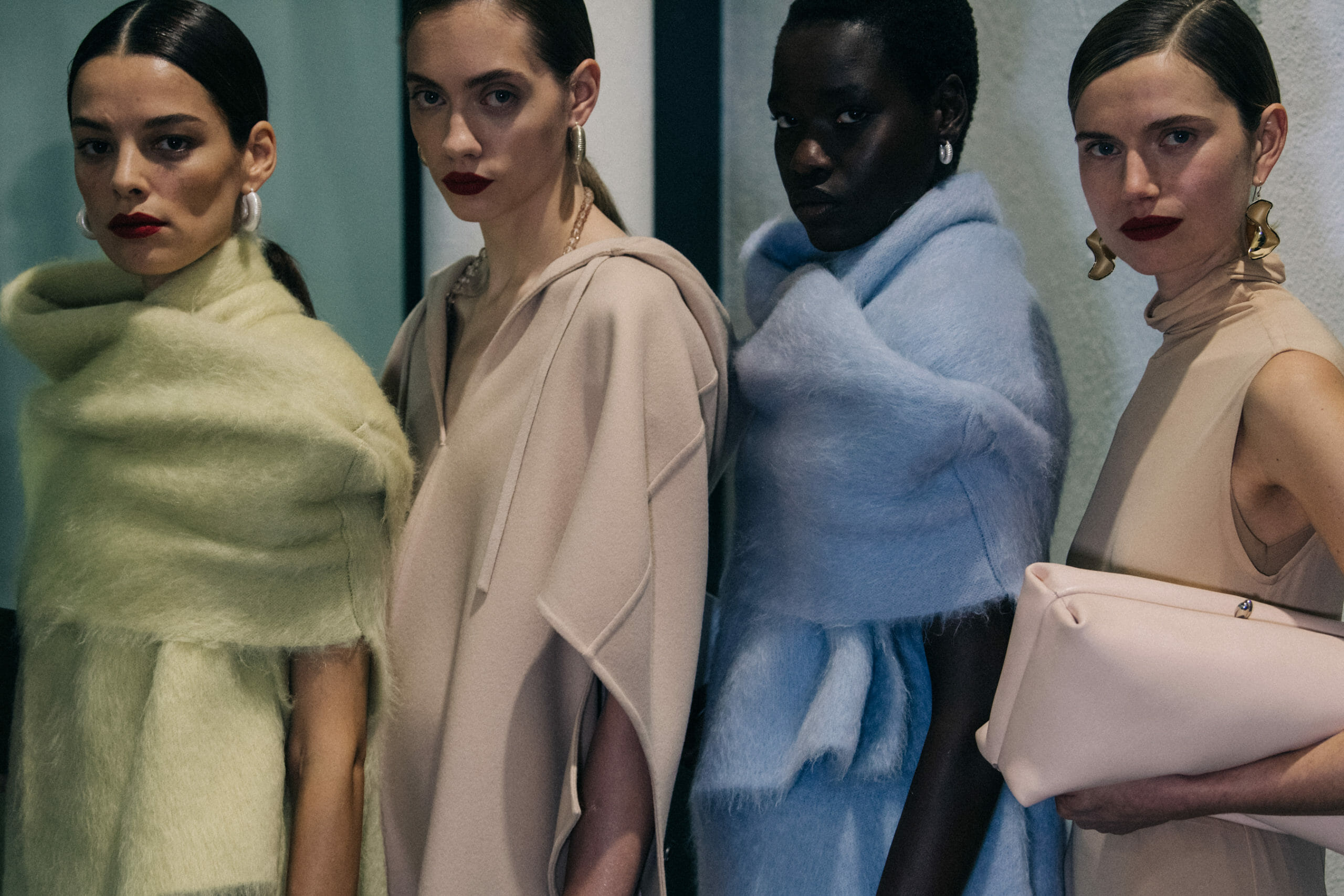 Models carrying Jil Sander bags