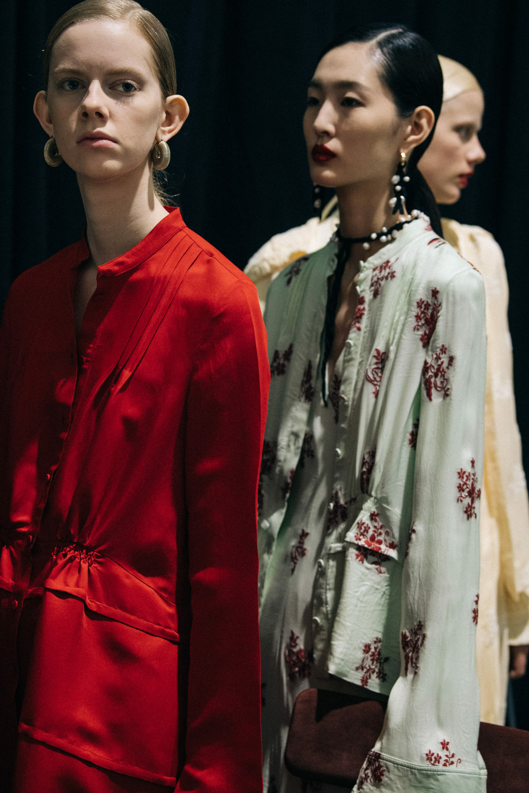 Model wearing red Jil Sander outfit