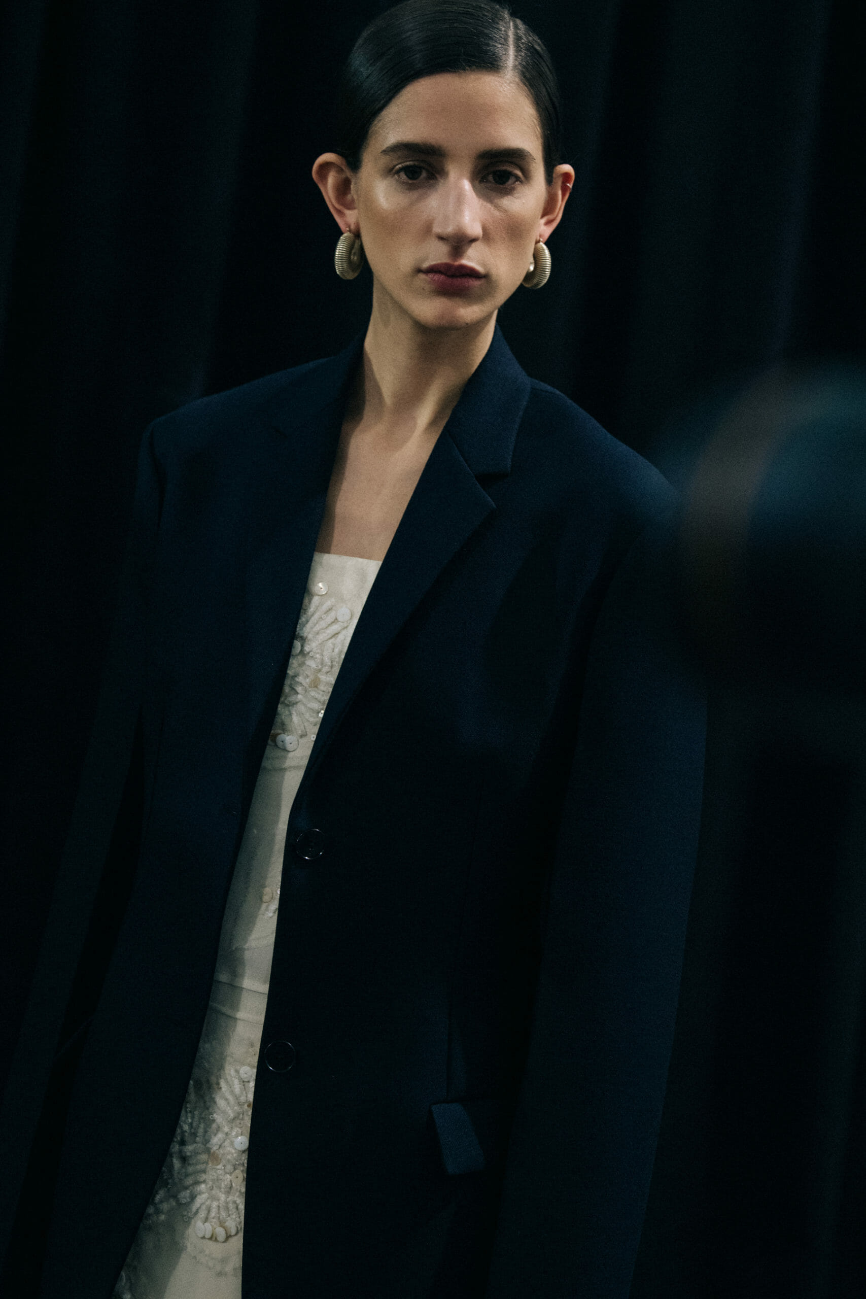 Model wearing black Jil Sander outfit