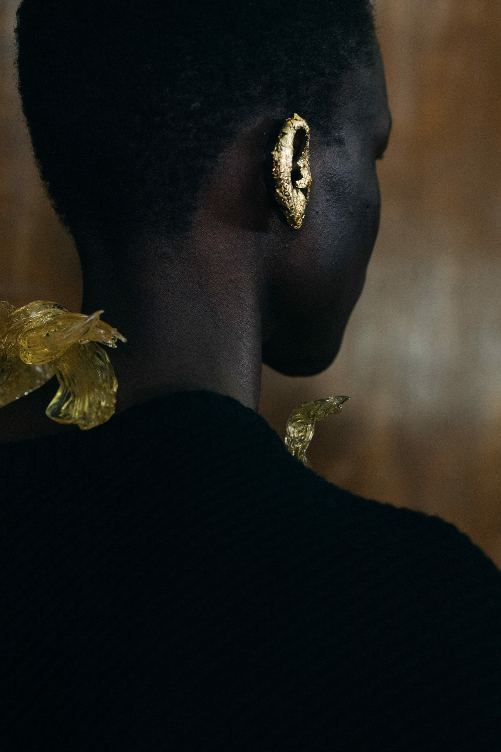 Model wearing gold foil