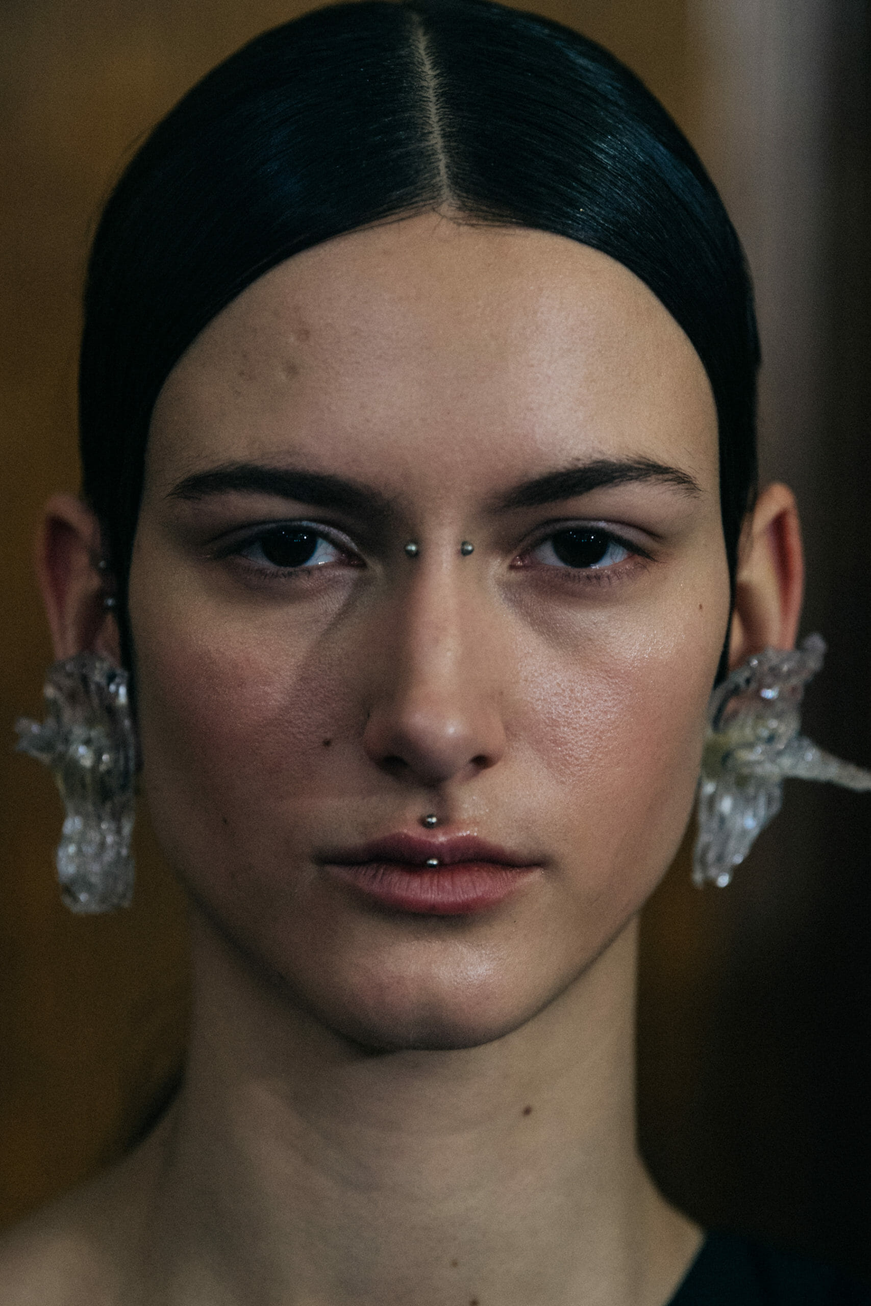Model wearing interesting earring