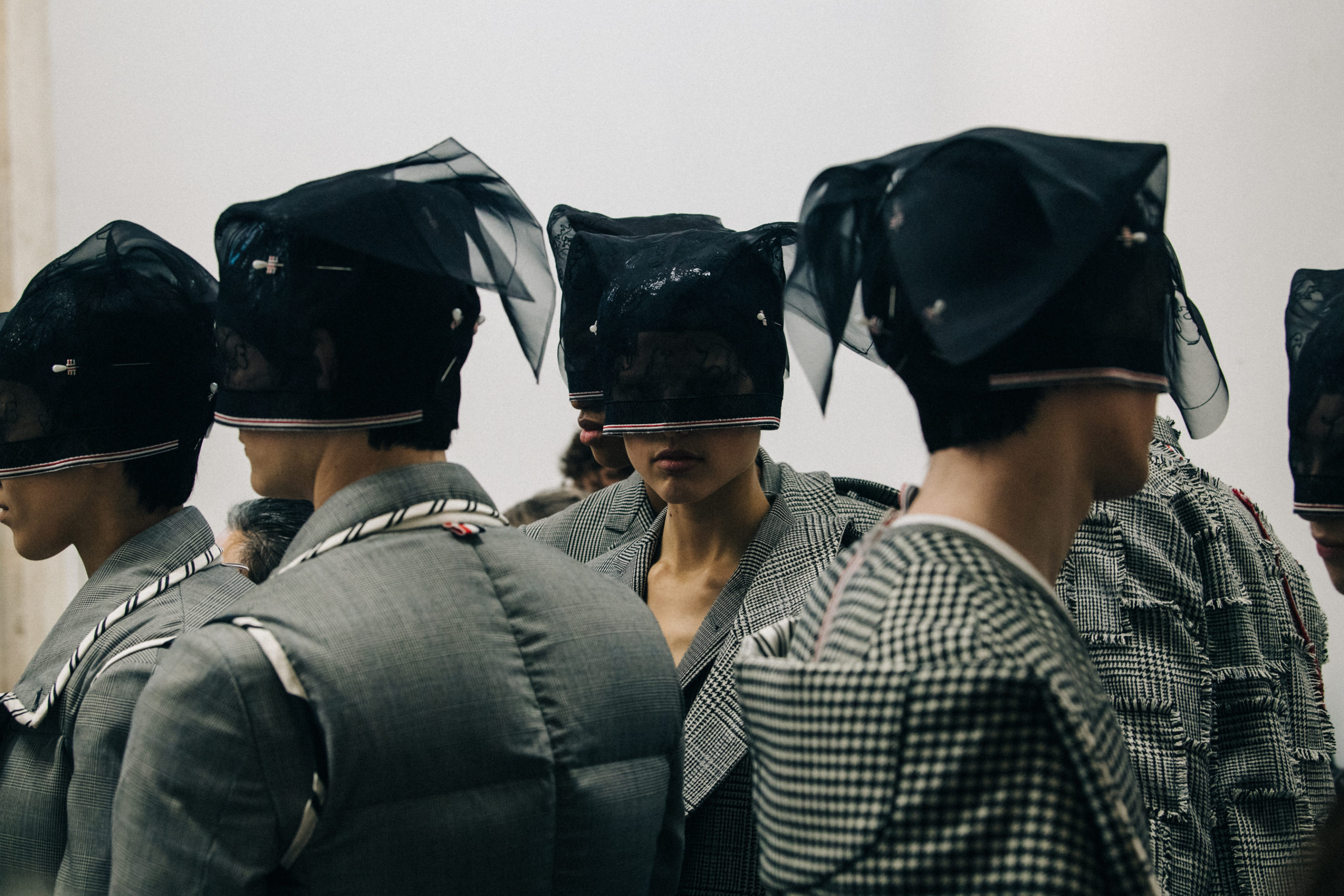 Models wearing Thom Browne suits
