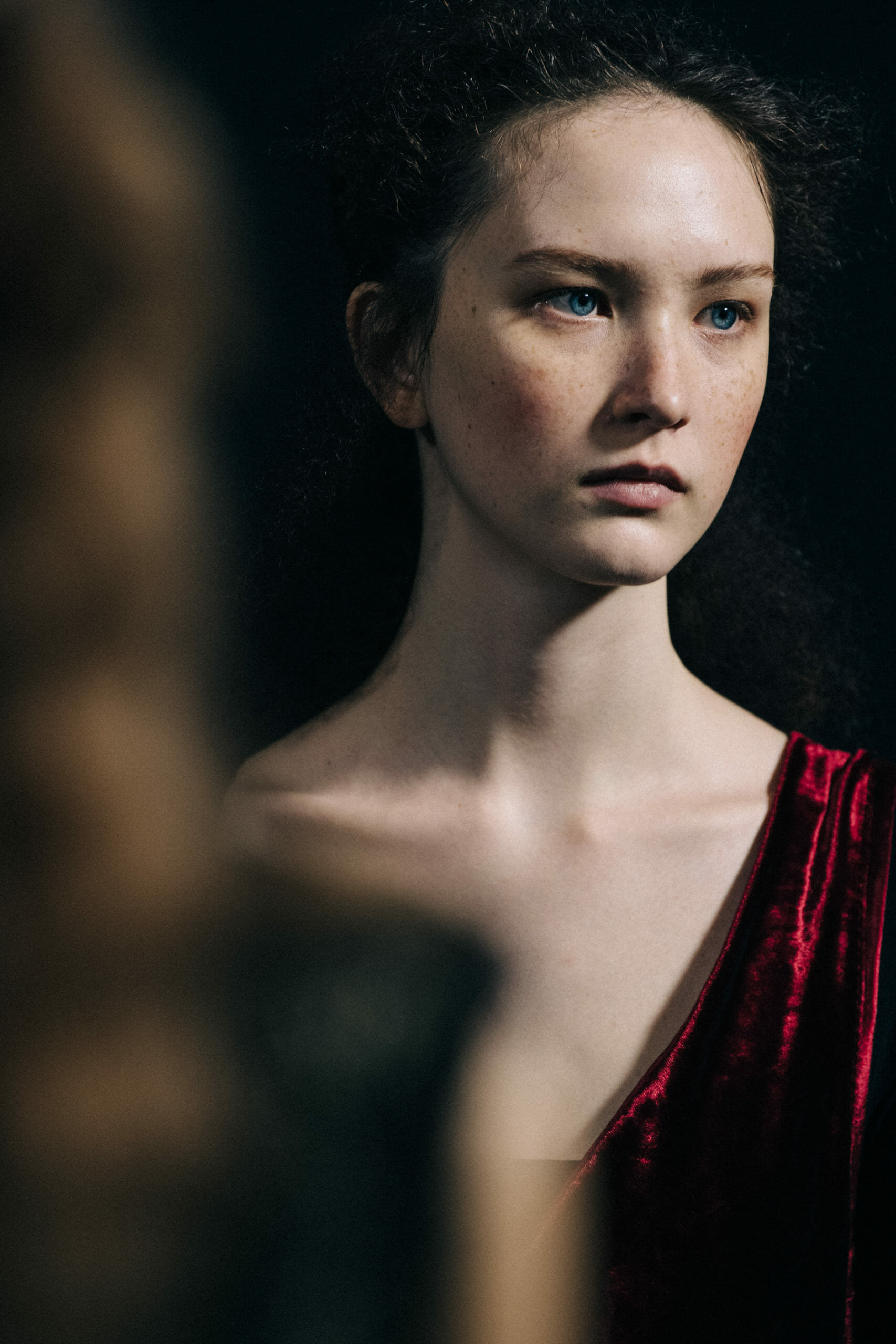 Model wearing red Ann Demeulemeester dress
