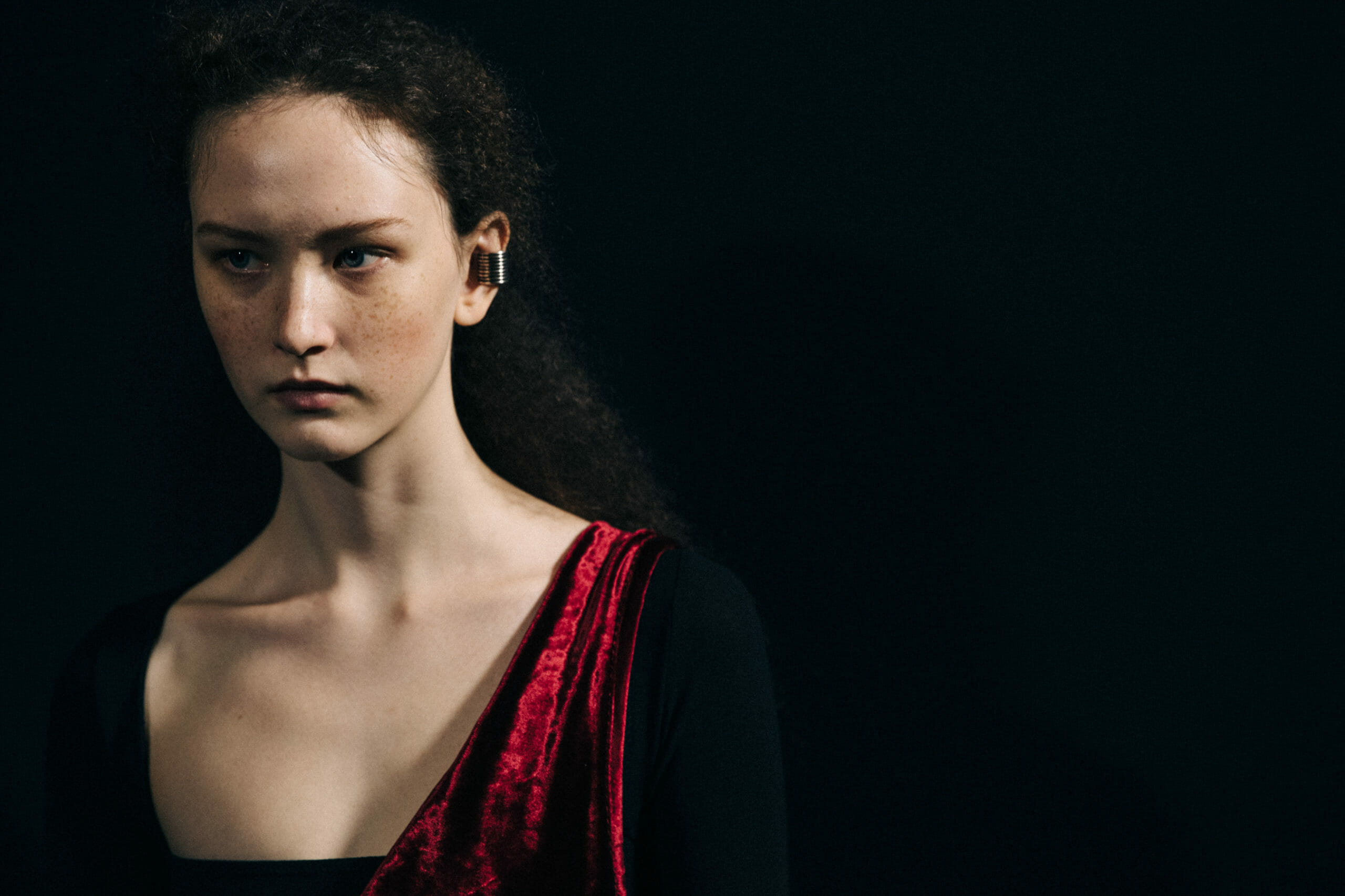 Model wearing red Ann Demeulemeester dress