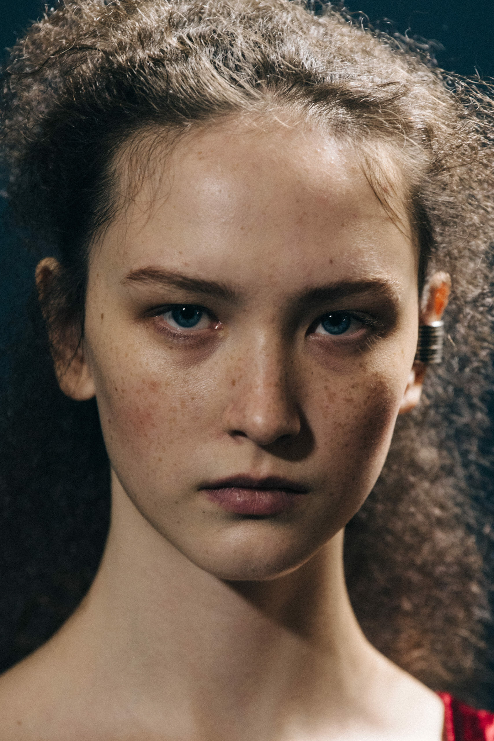 Model wearing red Ann Demeulemeester dress