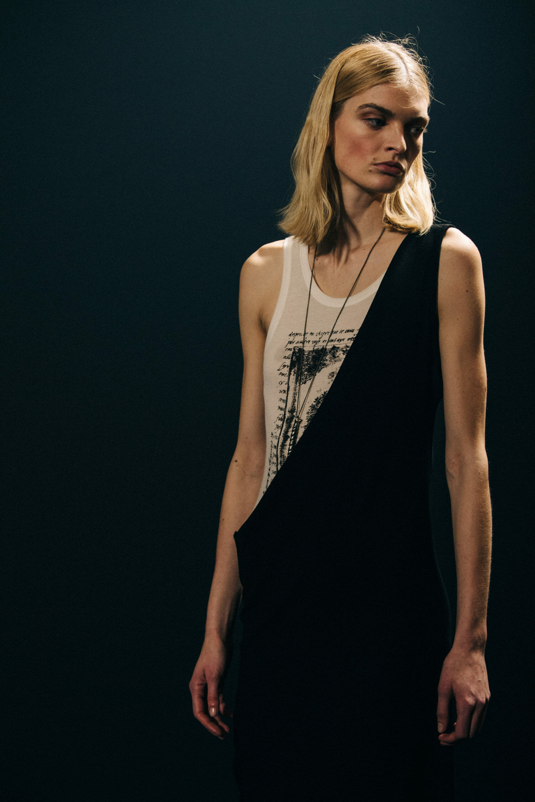 Model wearing white vest at Ann Demeulemeester