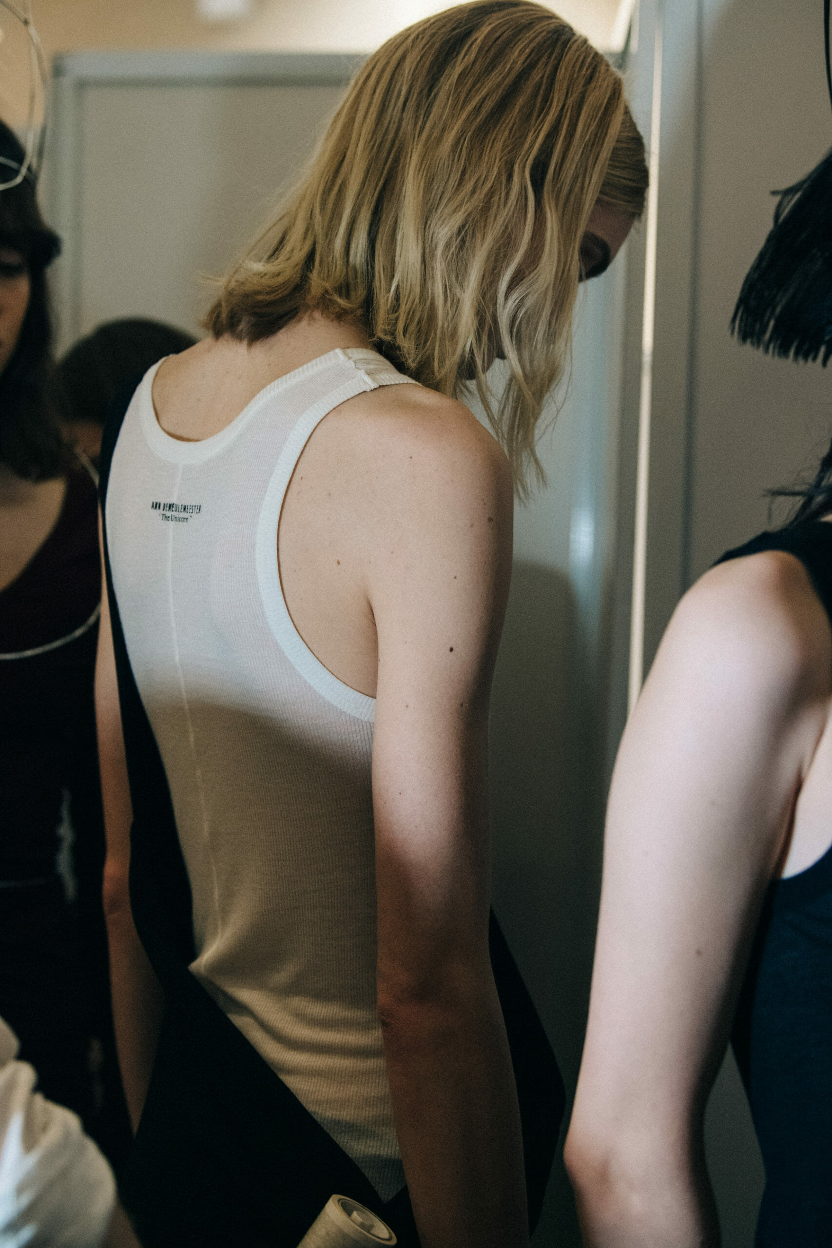 Model wearing white vest at Ann Demeulemeester