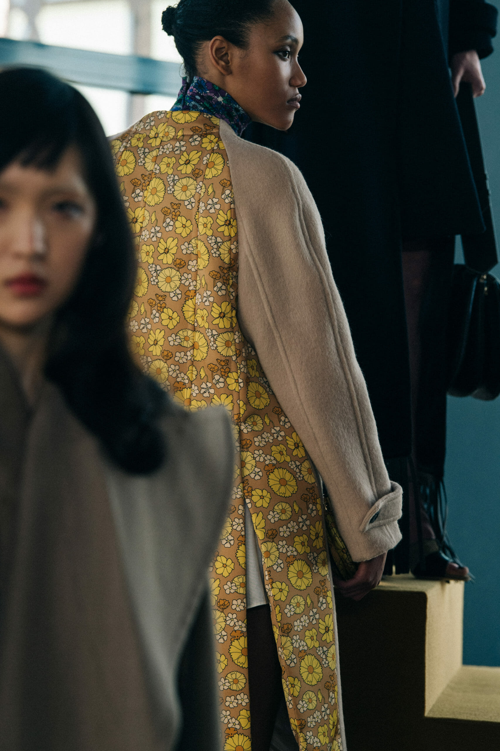 Model wearing yellow floral pattern