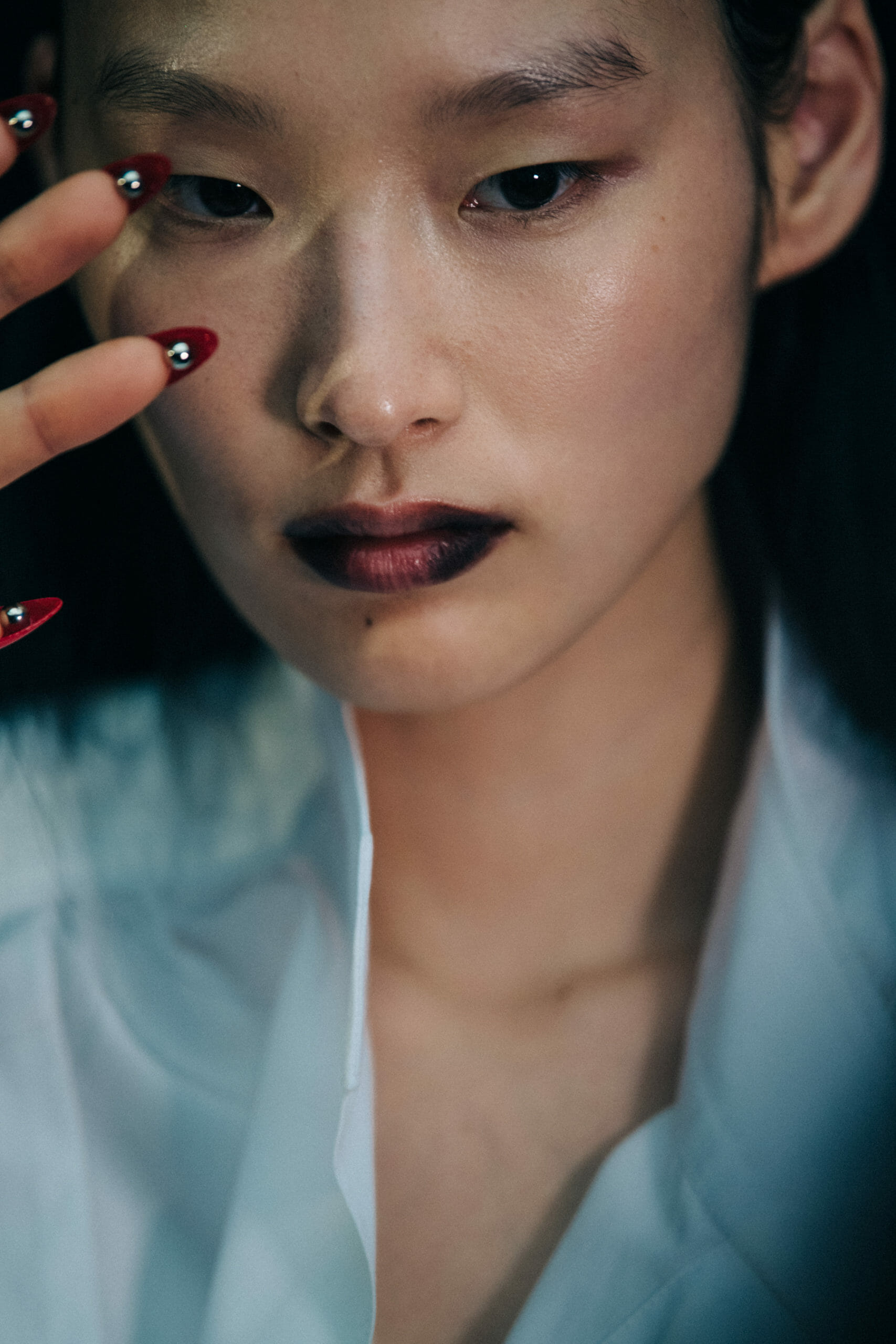 Model wearing white Mugler shirt