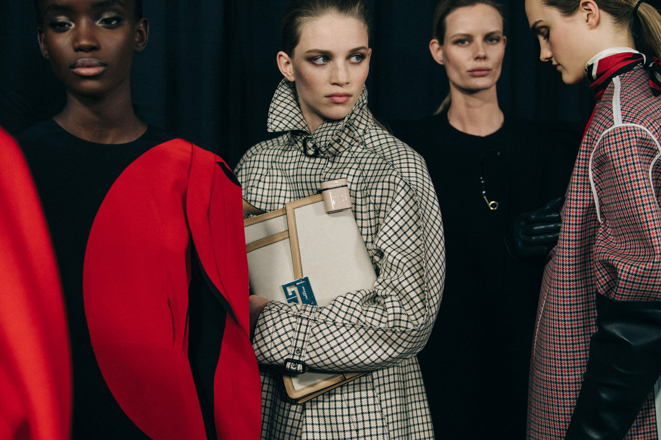 Model wearing pattern coat at Givenchy