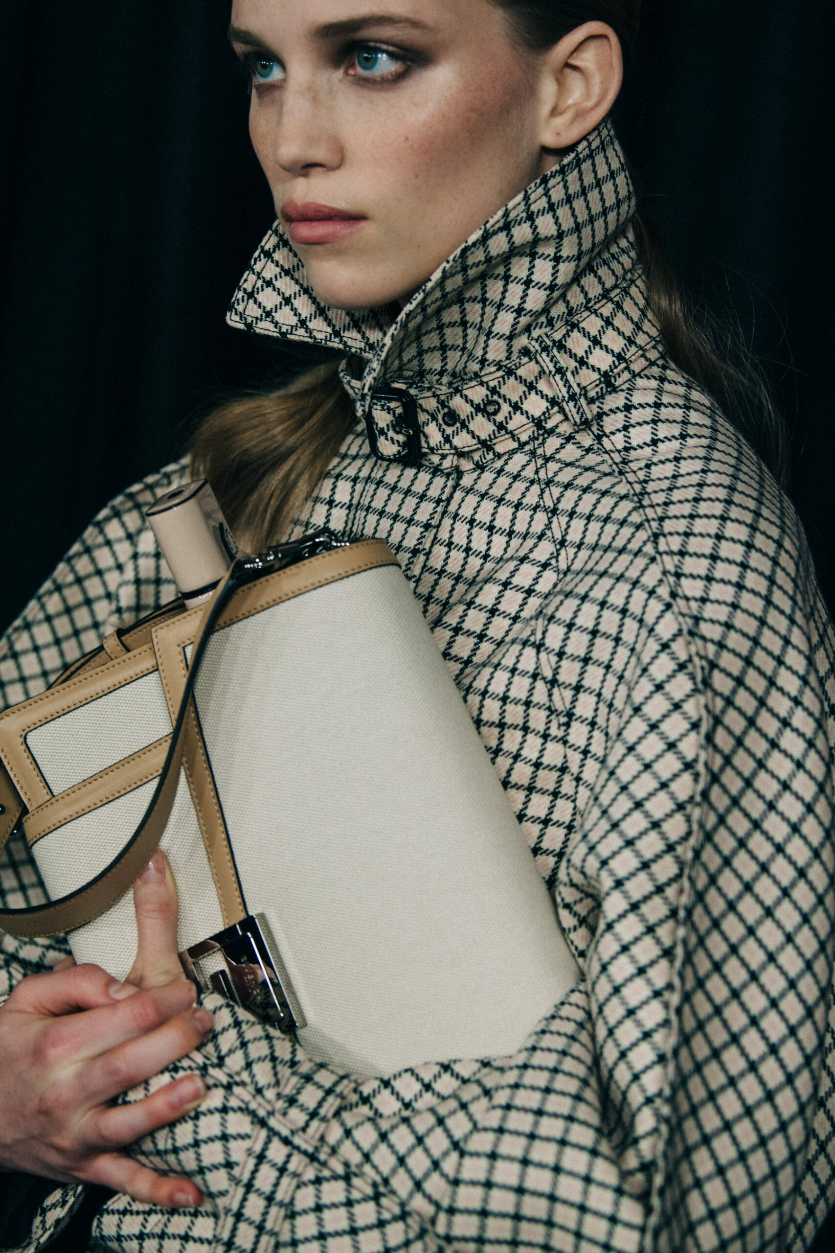 Model wearing pattern coat at Givenchy