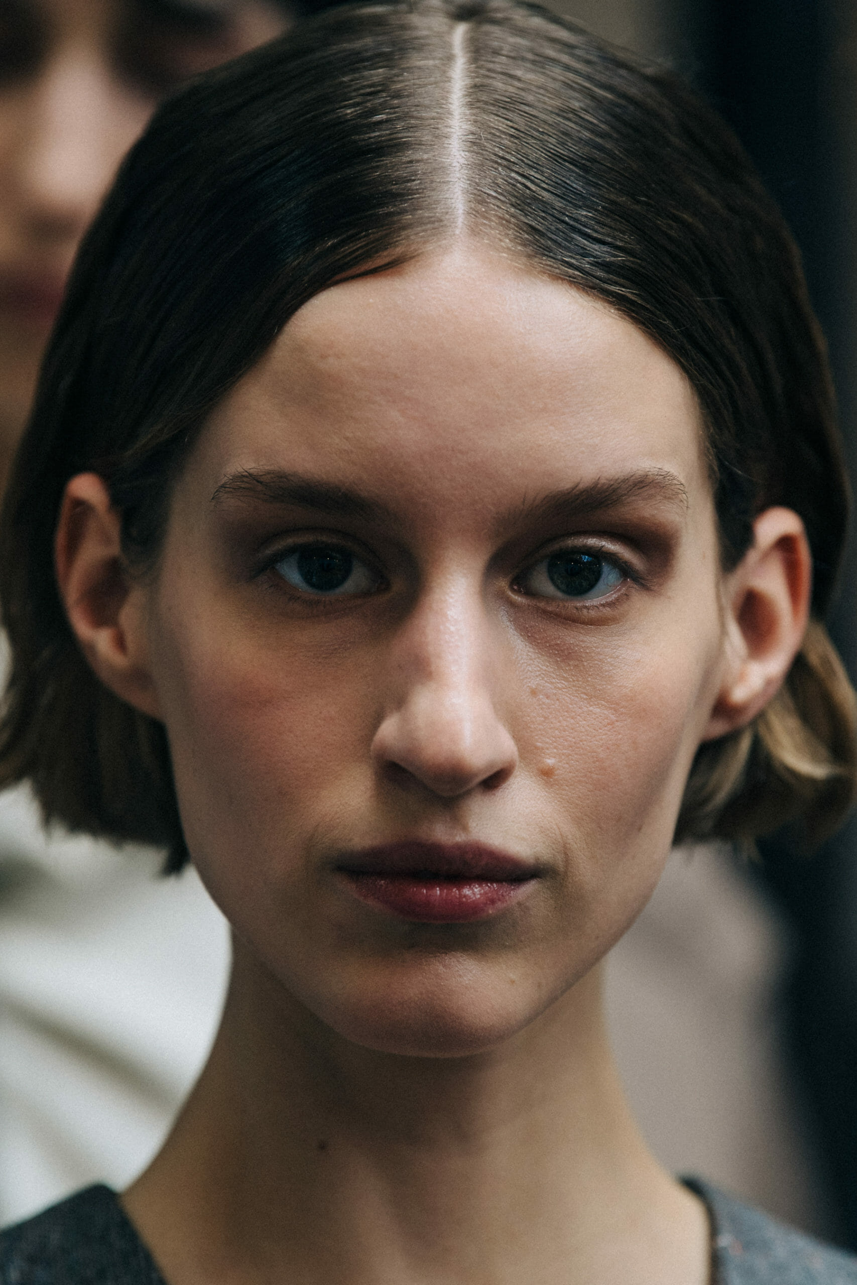 Model with slick brown hair