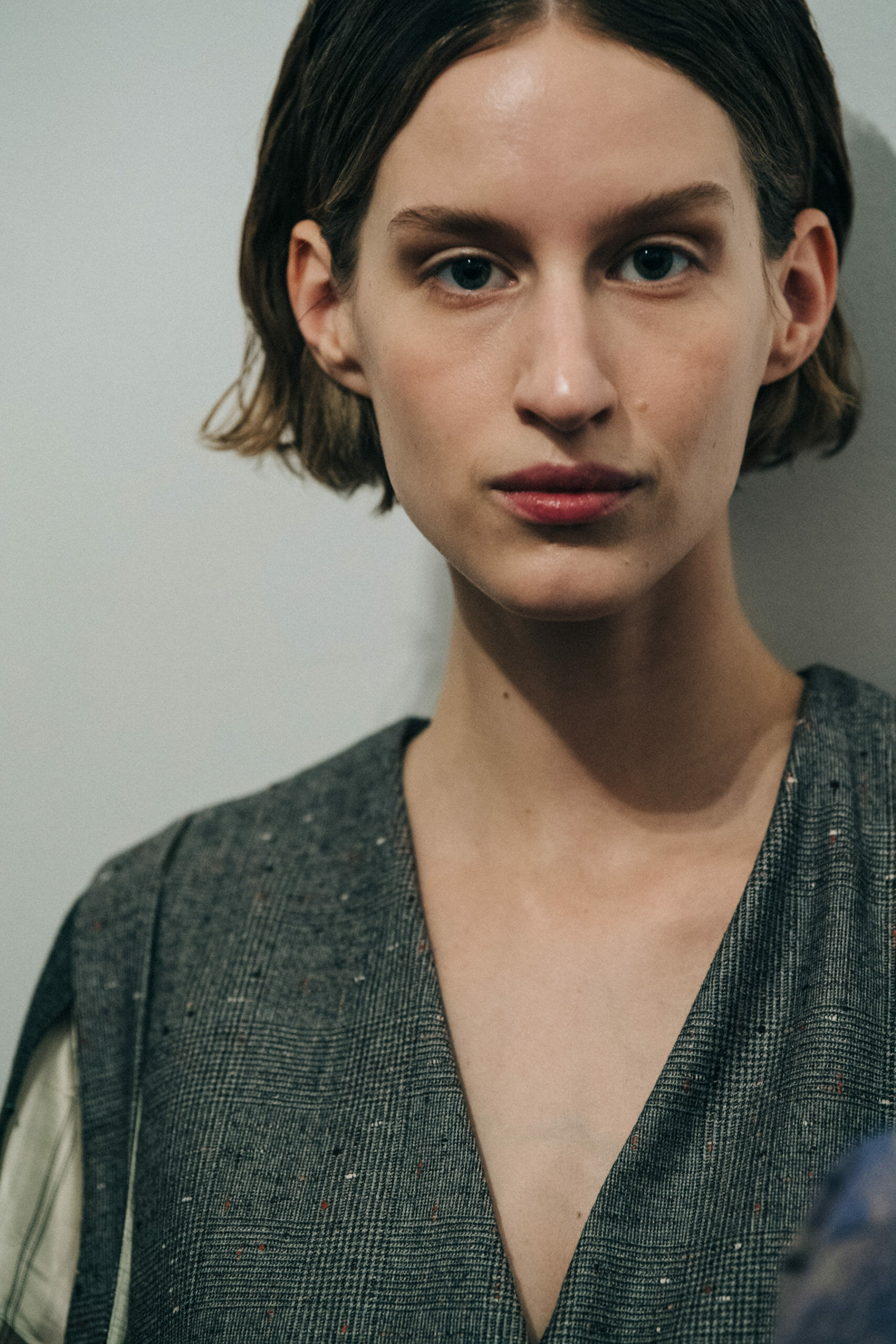Model wearing long wool coat at Nehera