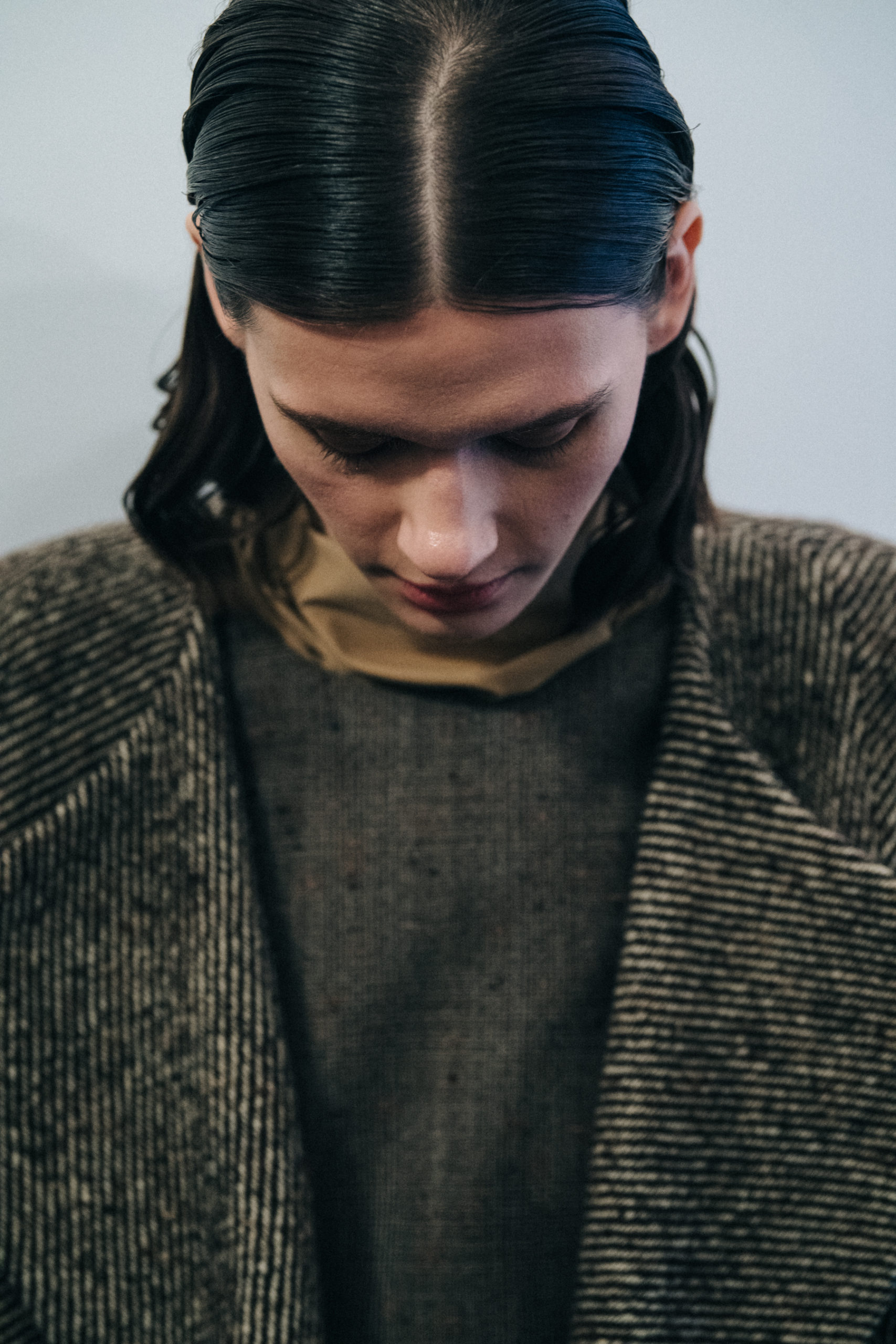 Model wearing long wool coat at Nehera