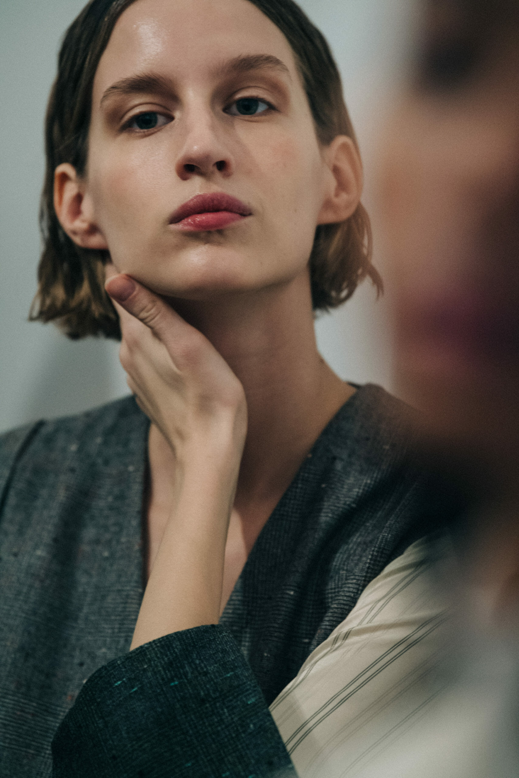 Model wearing long wool coat at Nehera