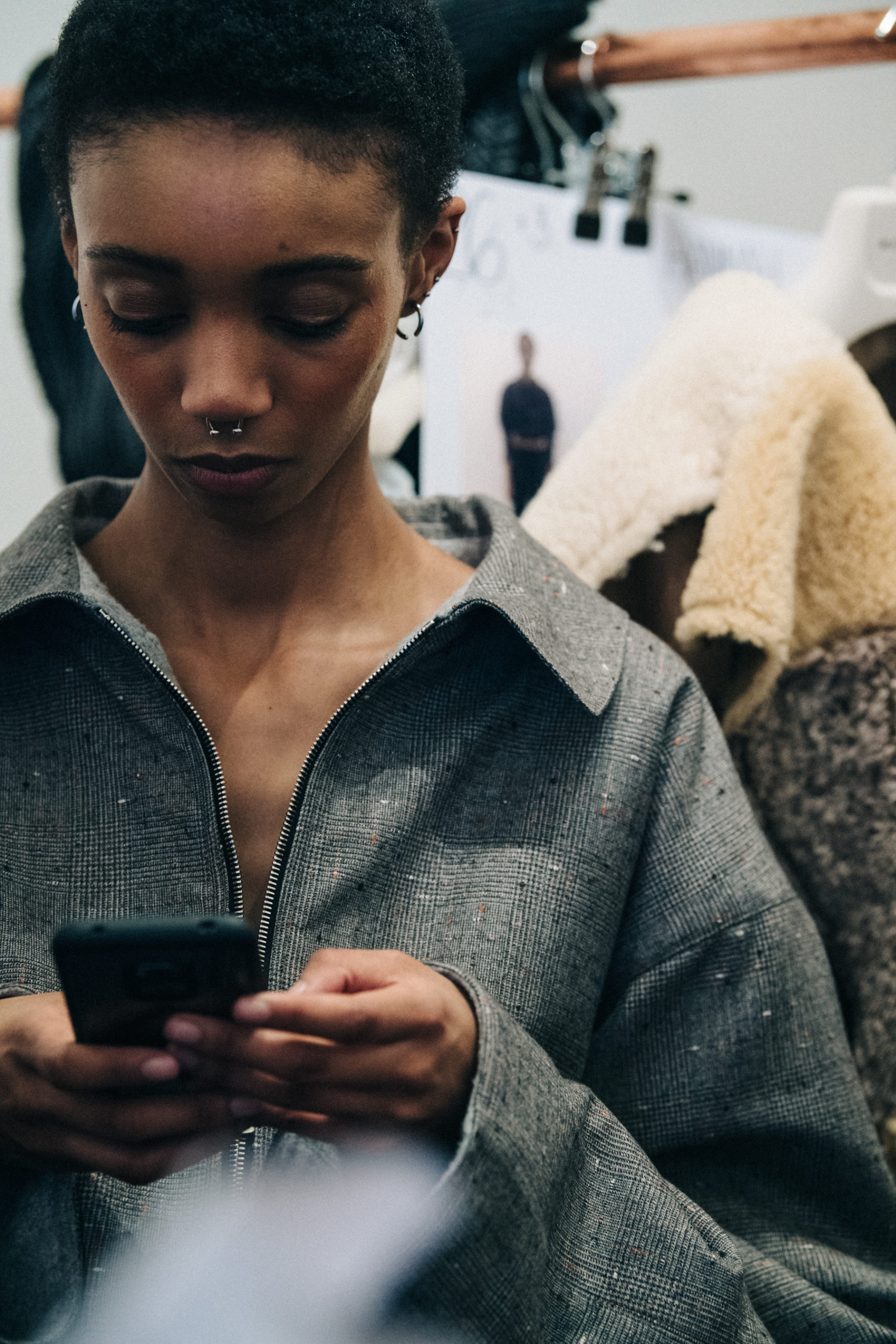 Model wearing long wool coat at Nehera