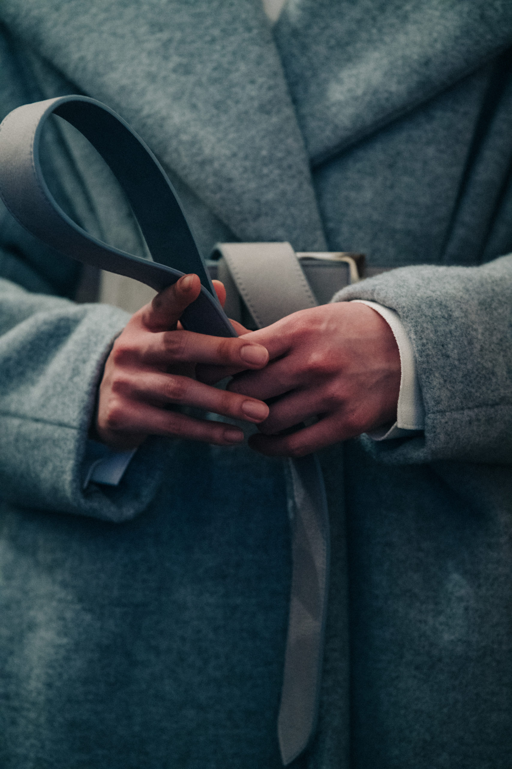 Model wearing long wool coat at Nehera