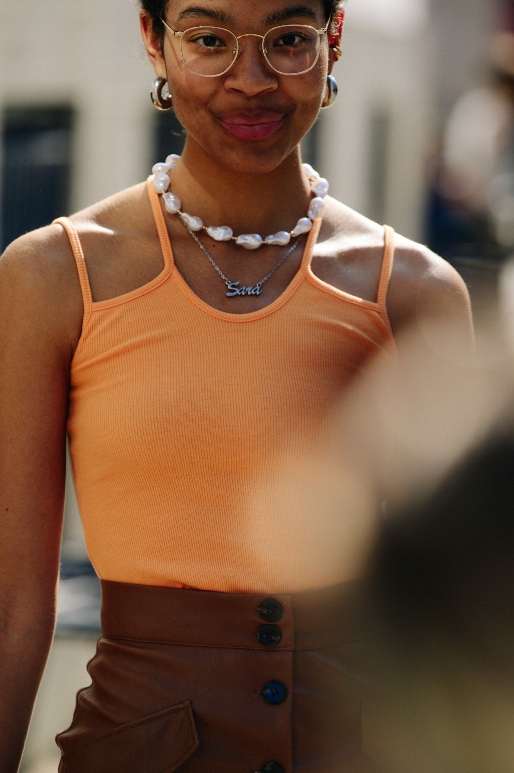 Woman wearing orange crop top