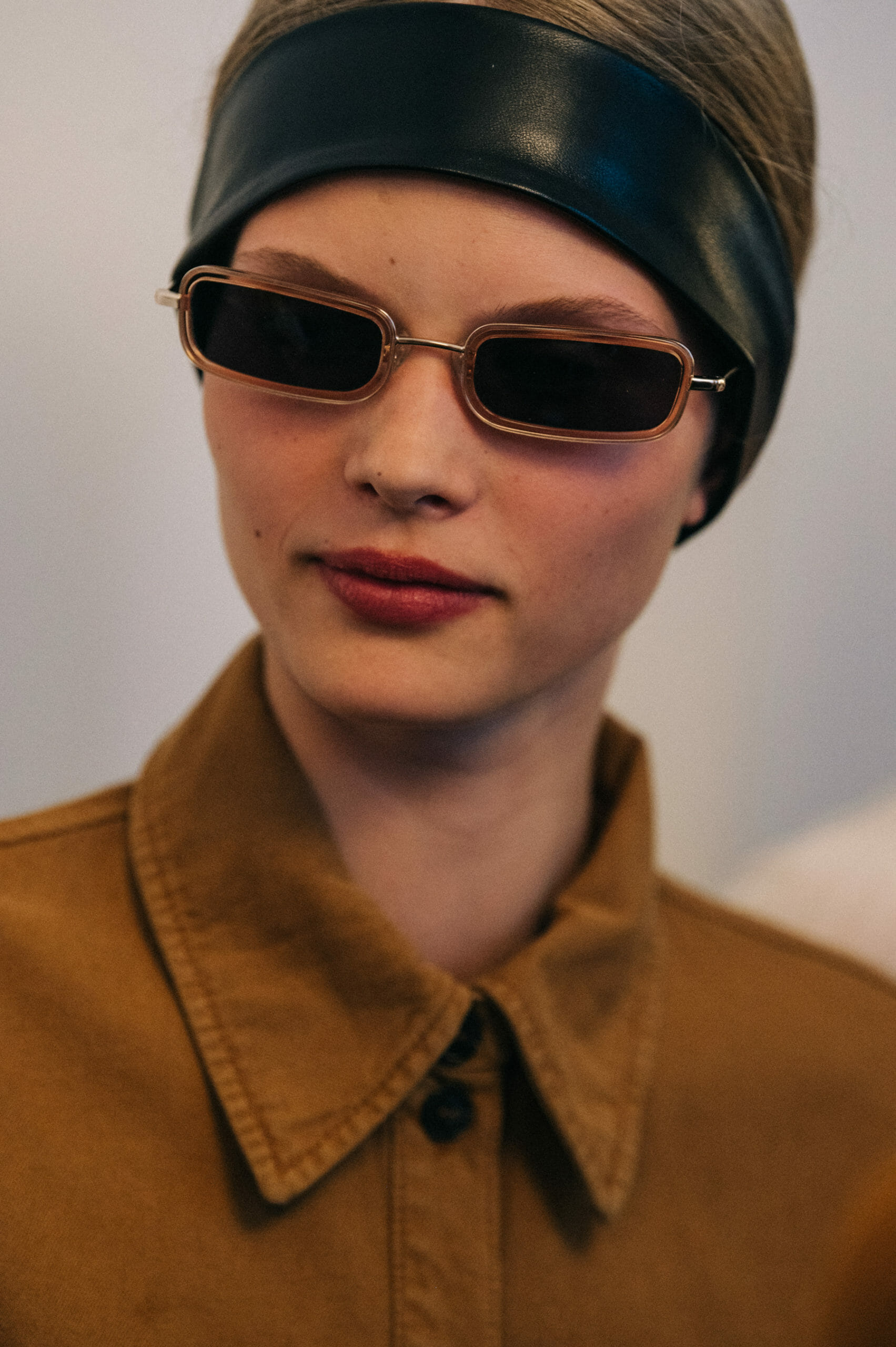 Model wearing leather headband