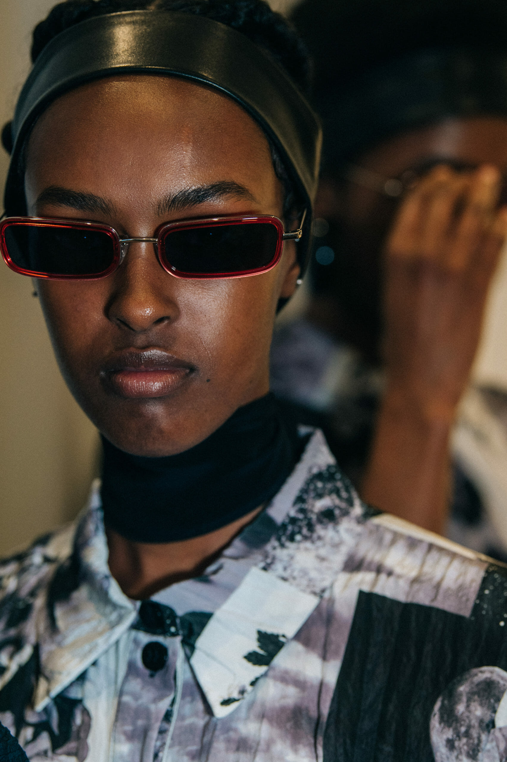 Model wearing leather headband