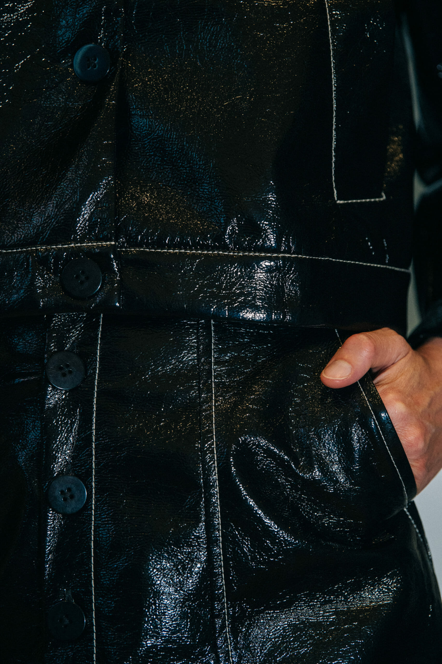 Model wearing black leather