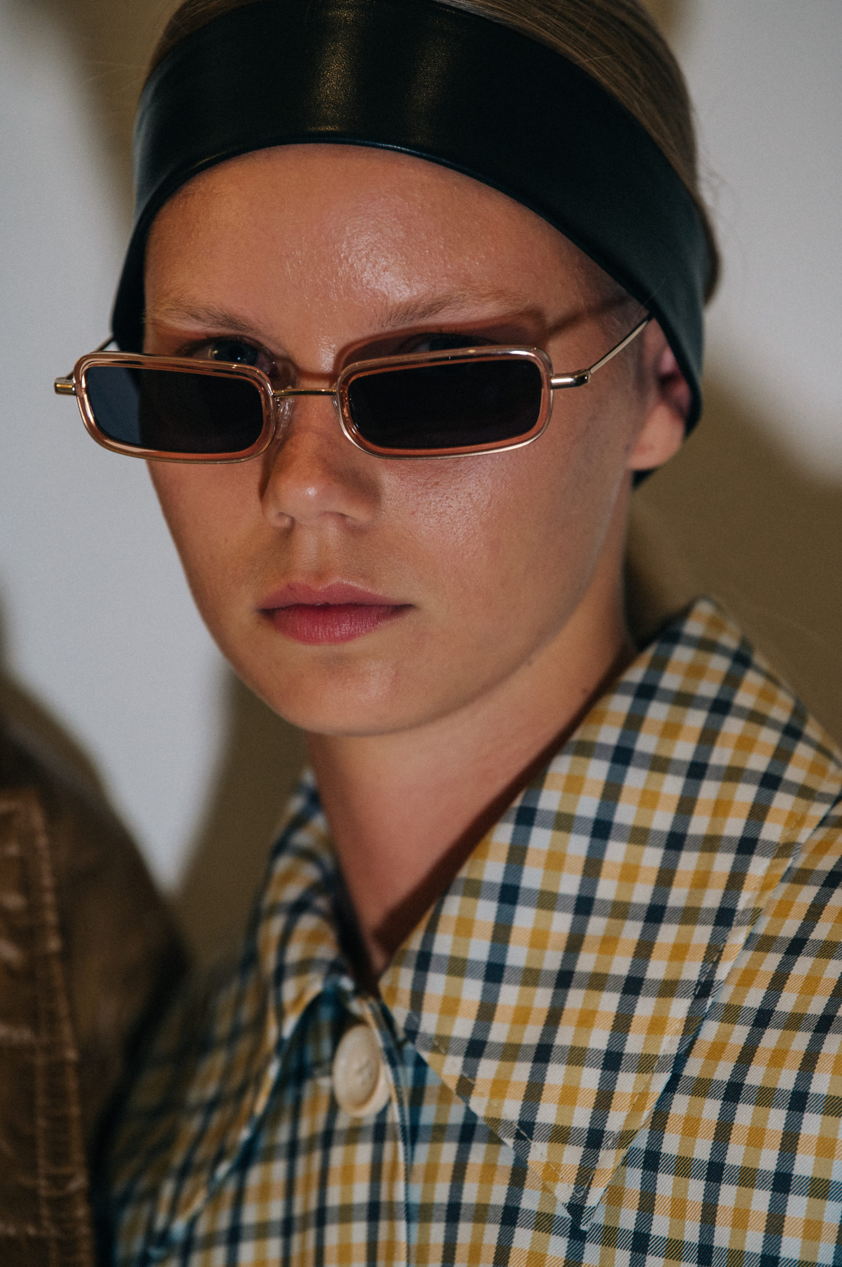 Model wearing leather headband