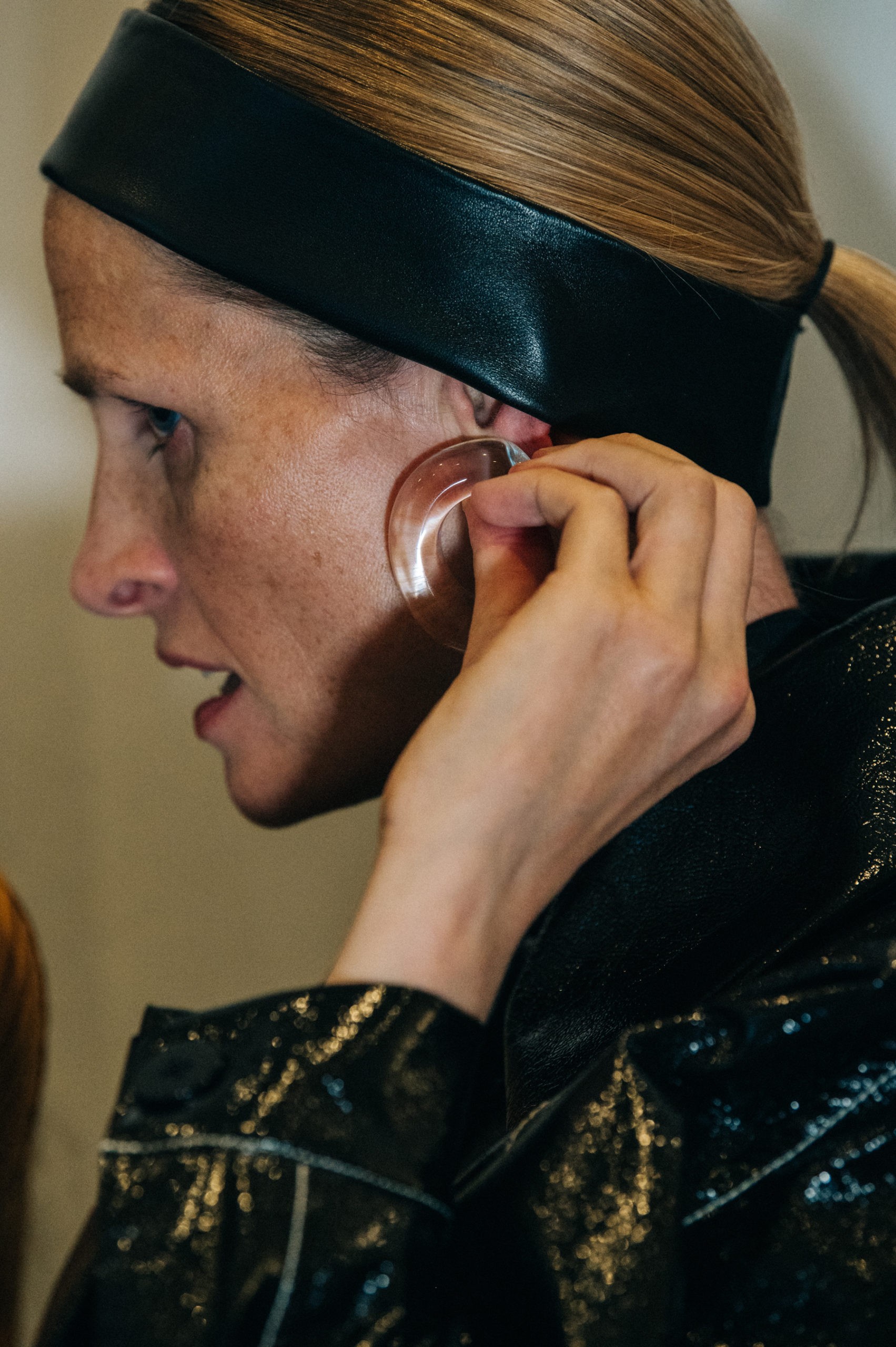 Model wearing leather headband
