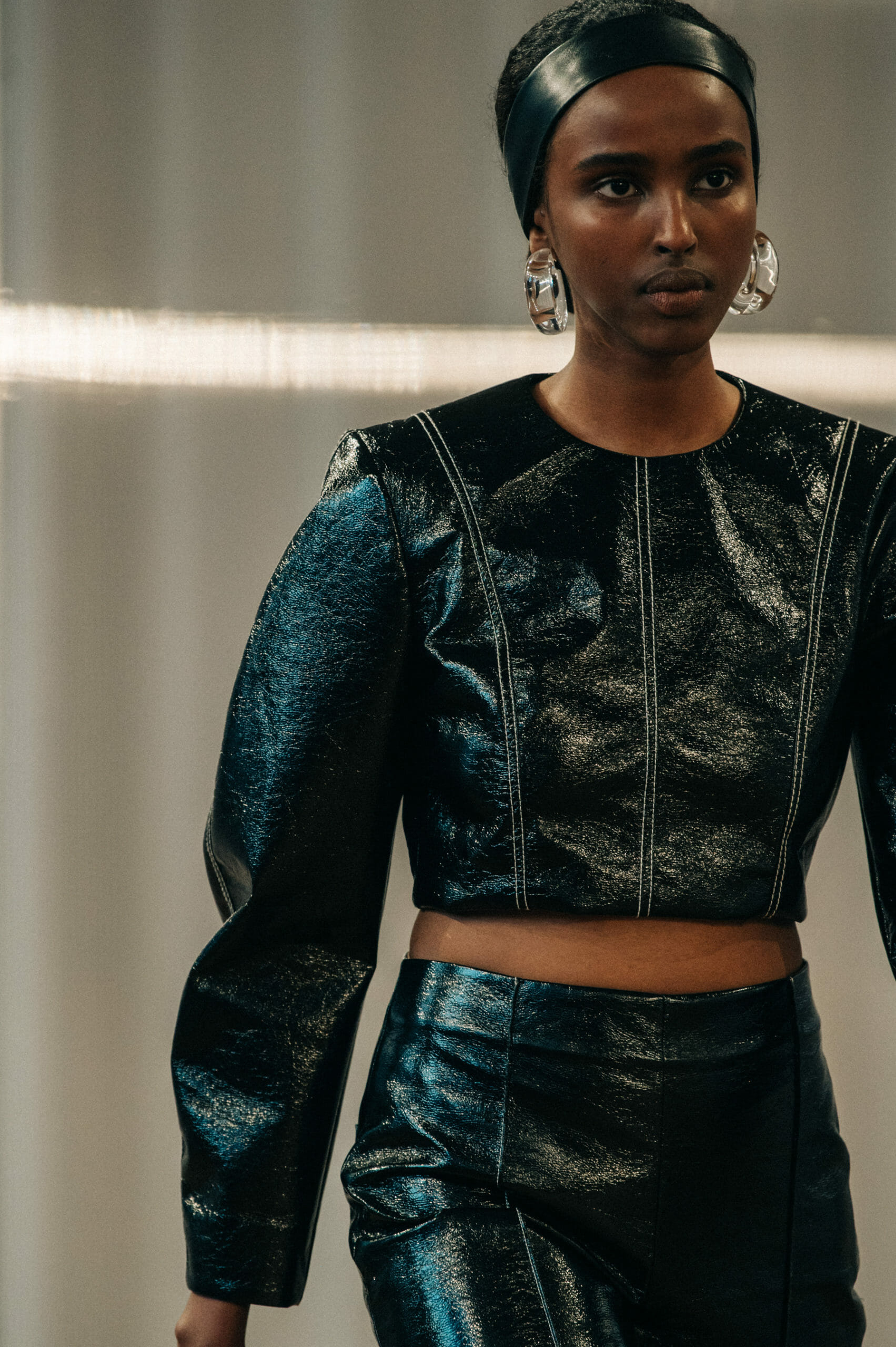 Model wearing leather headband