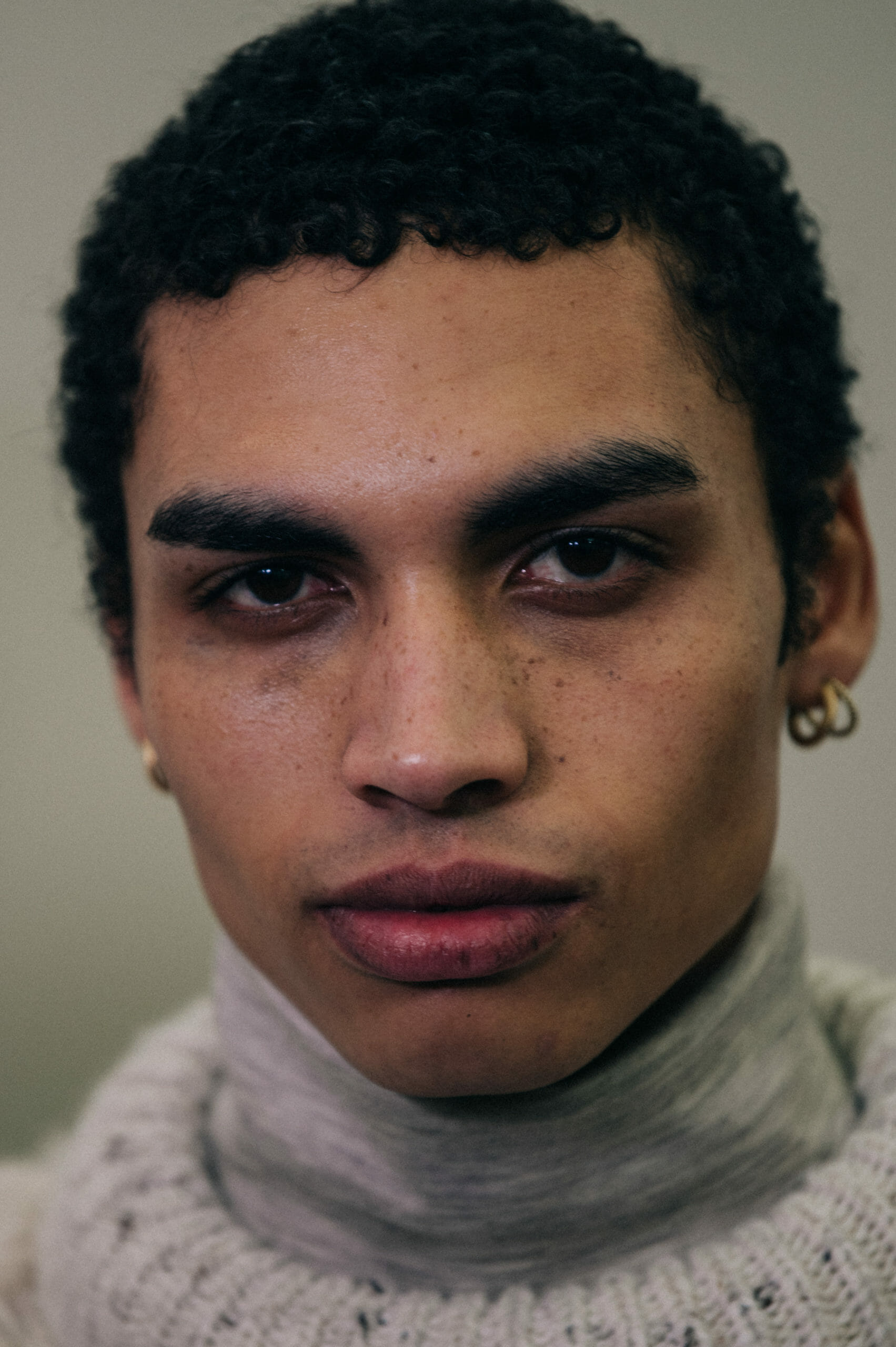 Model with short dark hair