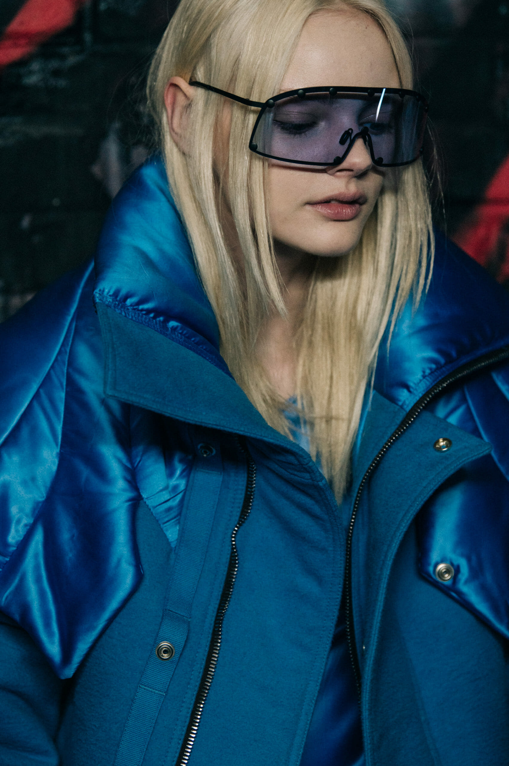Model wearing blue jacket at Rick Owens