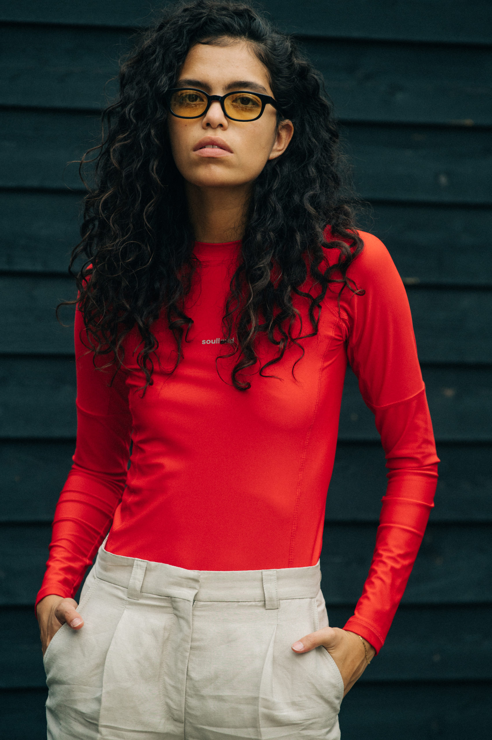 Model wearing red Soulland clothing