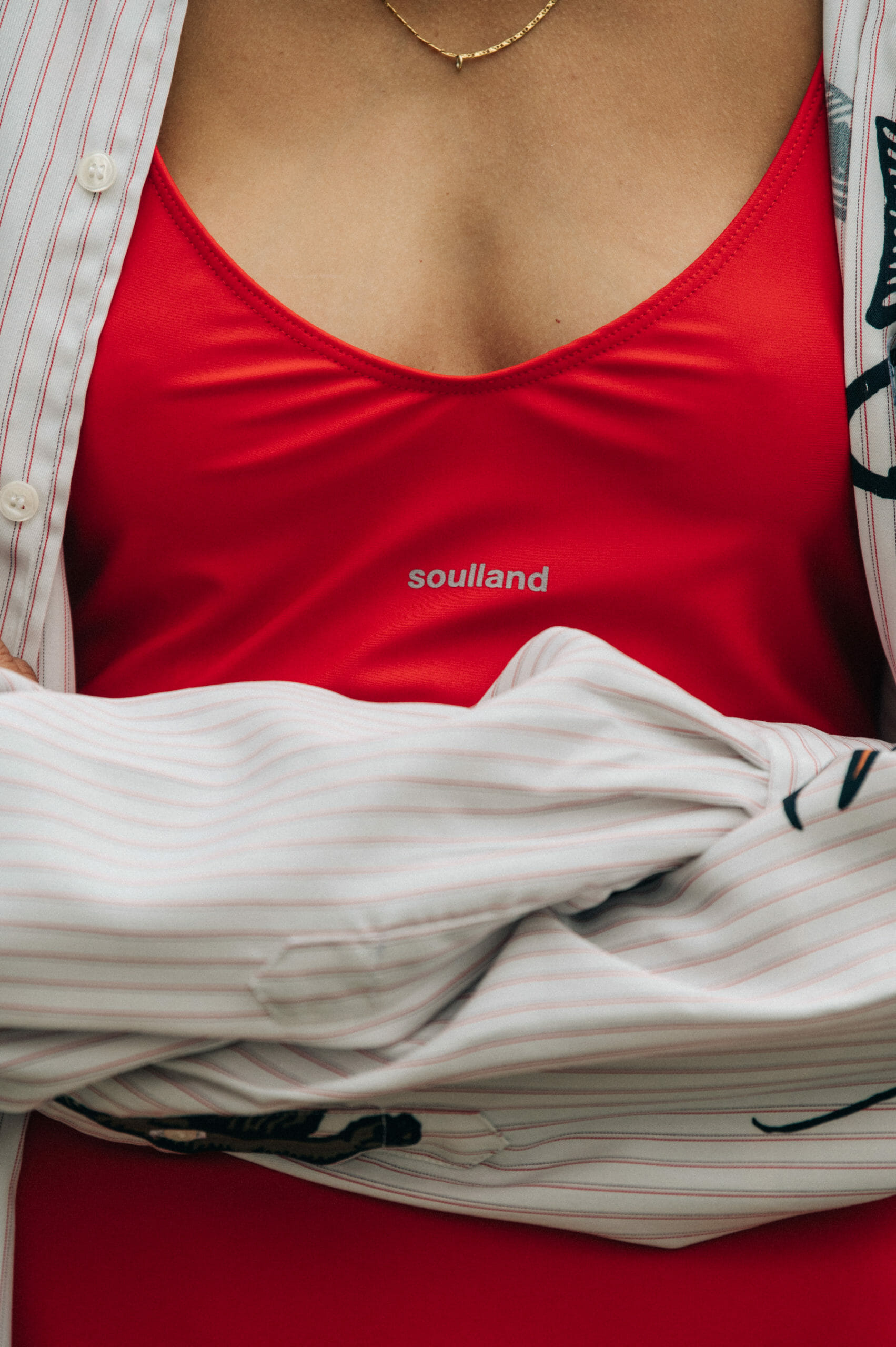 Model wearing red Soulland clothing