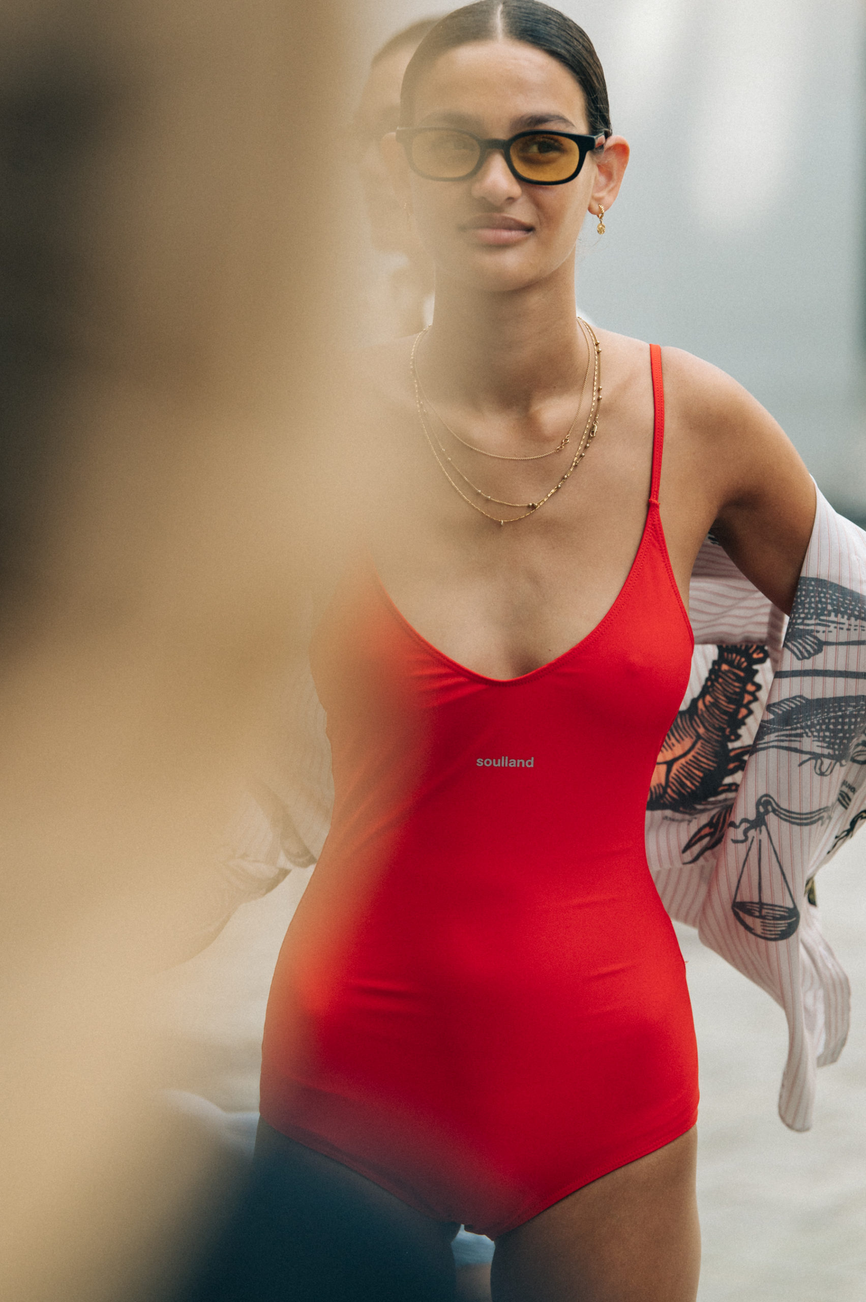 Model wearing red Soulland clothing